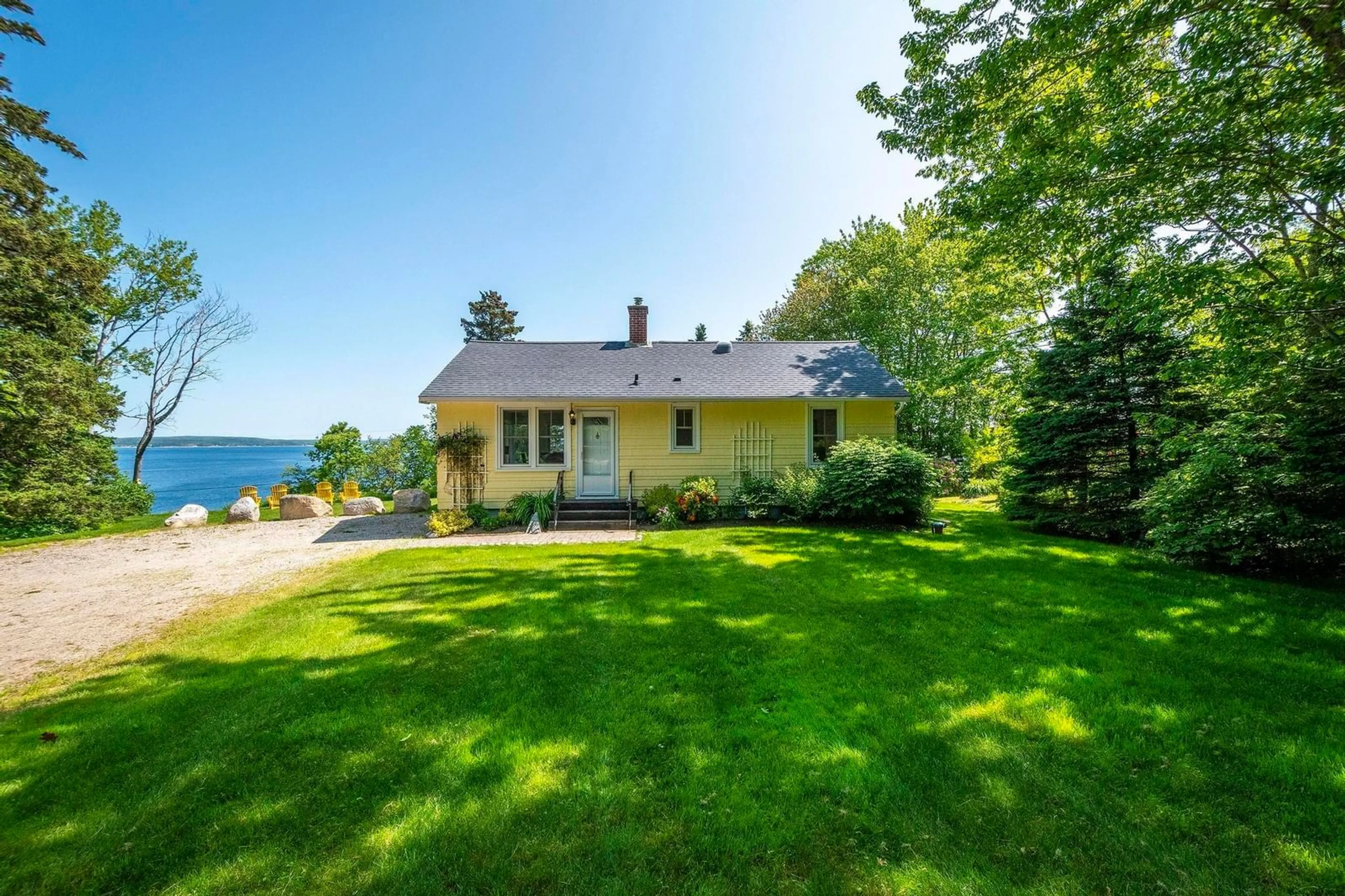 A pic from outside/outdoor area/front of a property/back of a property/a pic from drone, water/lake/river/ocean view for 1435 Highway 329, Mill Cove Nova Scotia B0J 1T0