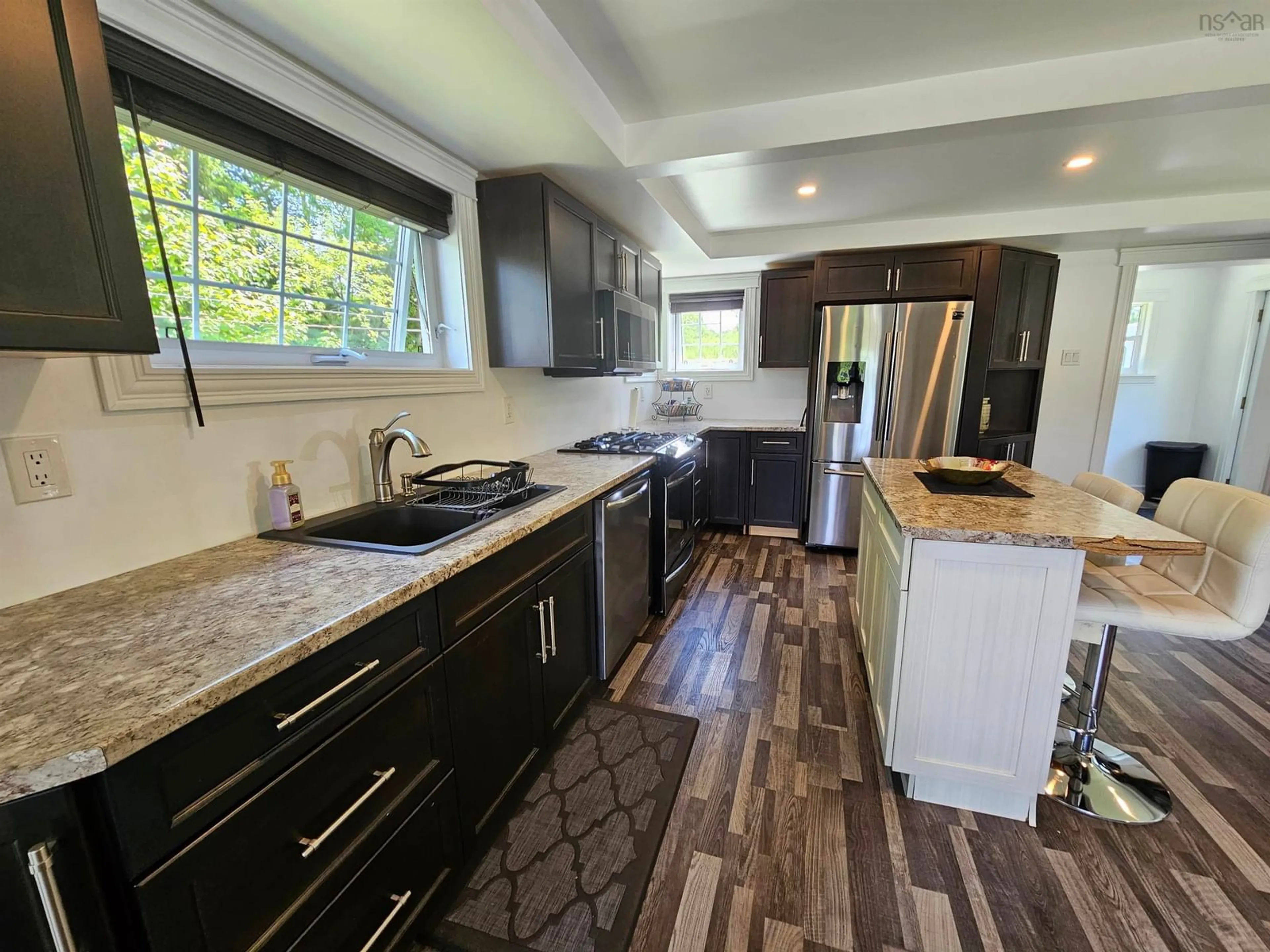 Open concept kitchen, wood/laminate floor for 1349 Georges River Rd, Georges River Nova Scotia B1Y 3J7