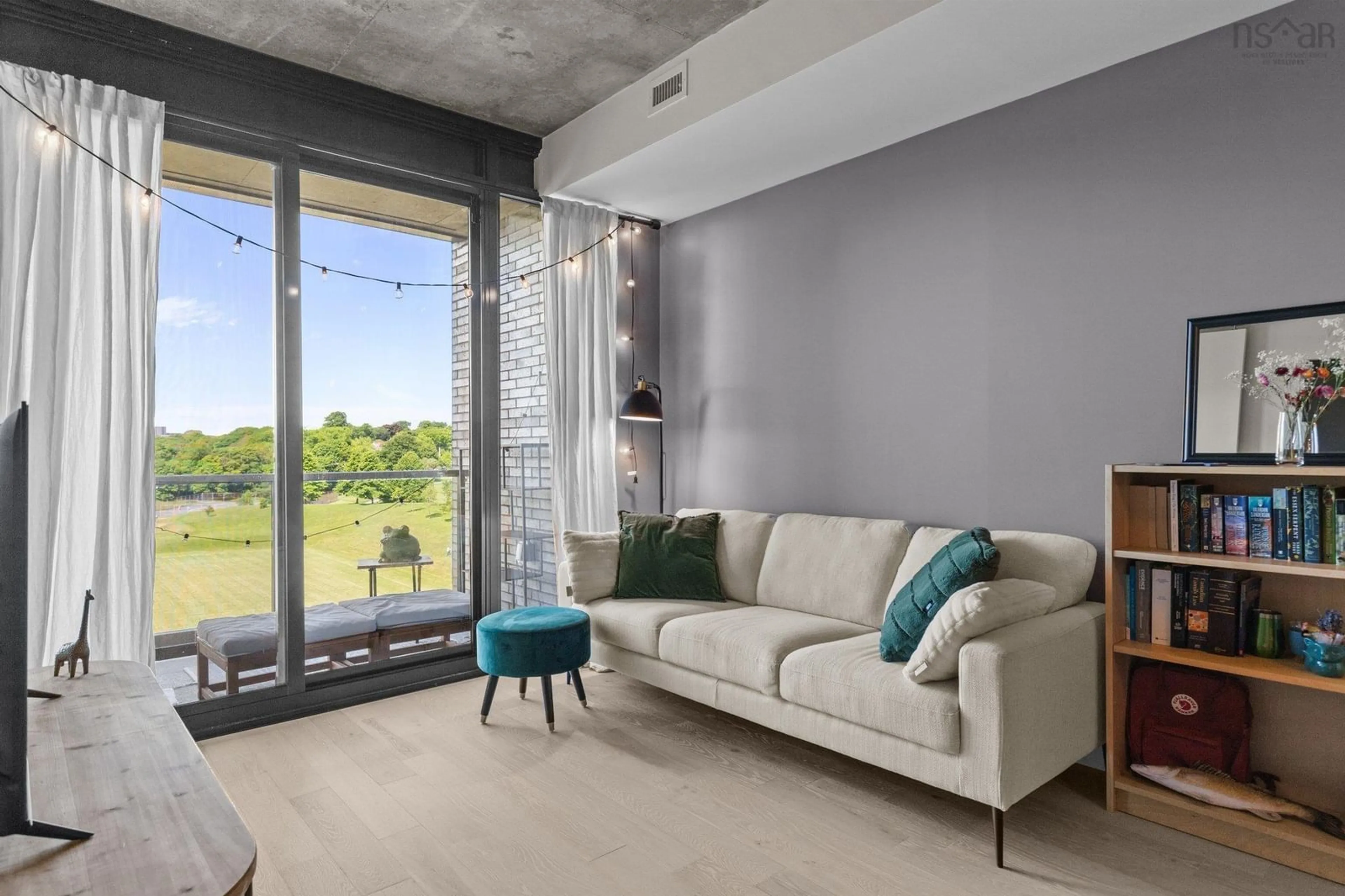 Living room with furniture, cement floor for 1048 Wellington St #618, Halifax Nova Scotia B3H 0C2