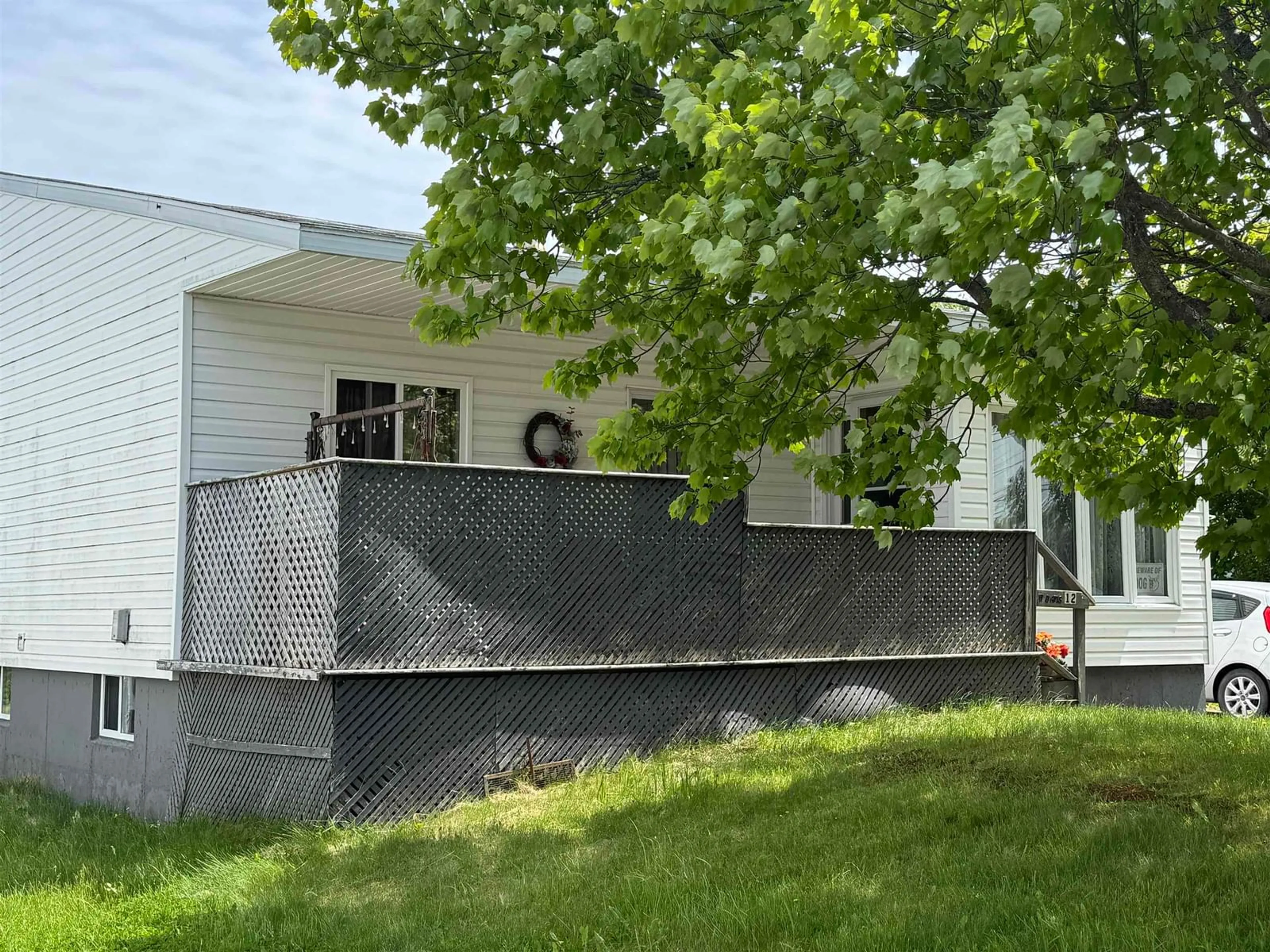 Home with vinyl exterior material, street for 12 Macnamara St, Sydney Mines Nova Scotia B1V 2M4