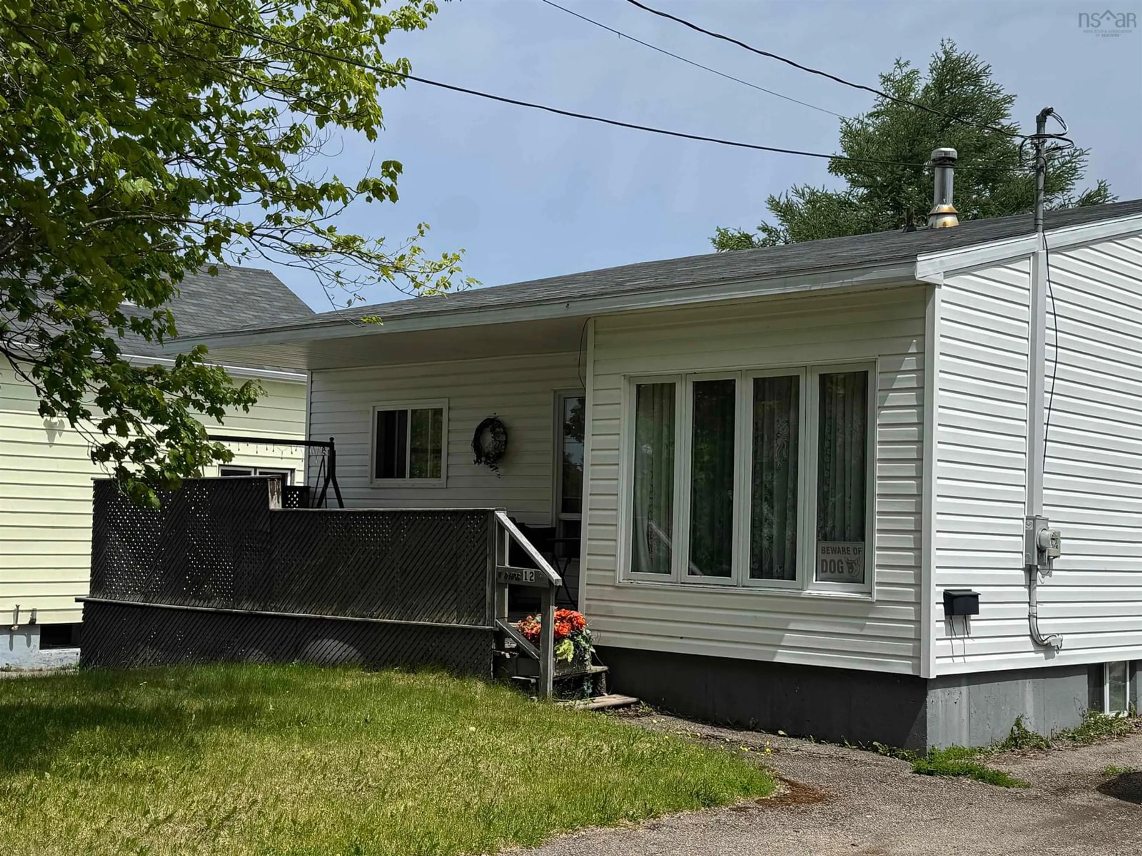 Home with vinyl exterior material, street for 12 Macnamara St, Sydney Mines Nova Scotia B1V 2M4