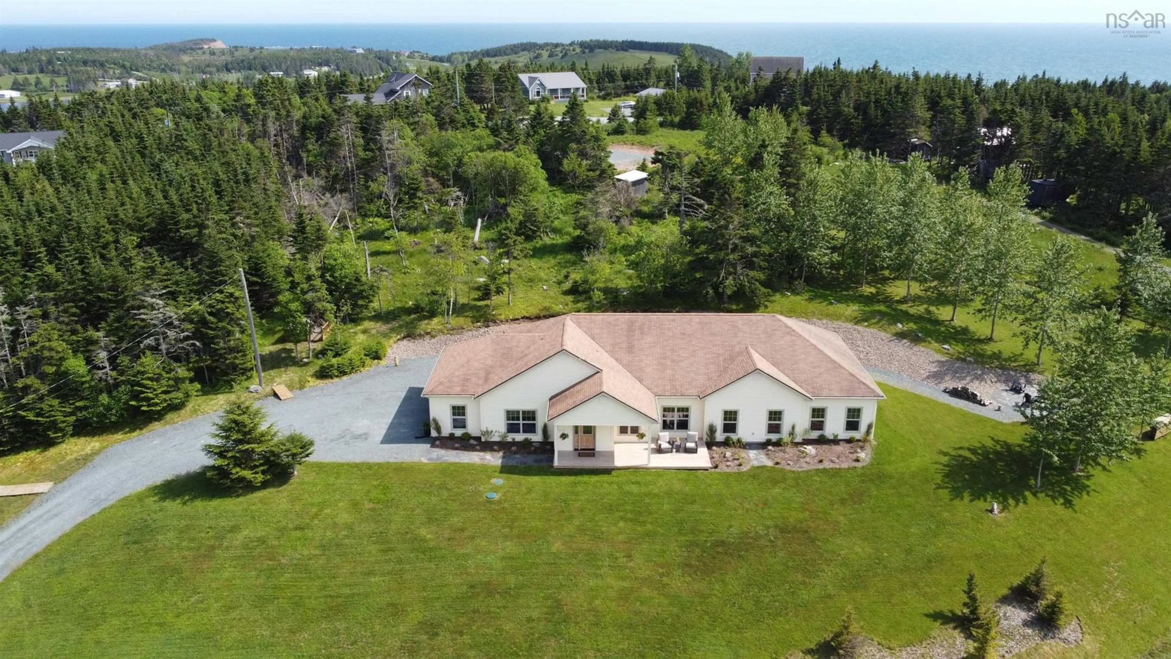 A pic from outside/outdoor area/front of a property/back of a property/a pic from drone, water/lake/river/ocean view for 84 Oceanic Dr, East Lawrencetown Nova Scotia B2Z 1T6
