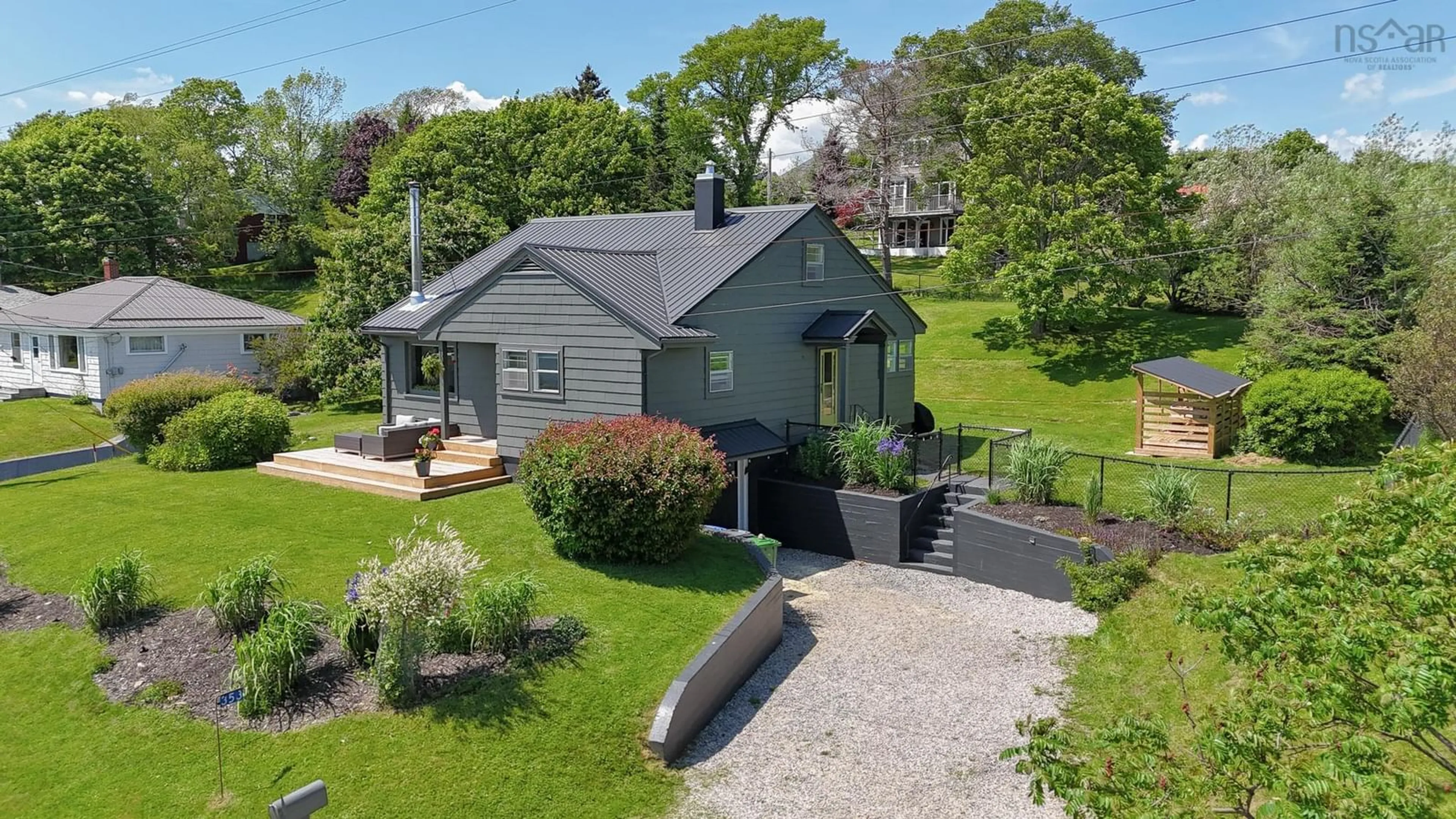 A pic from outside/outdoor area/front of a property/back of a property/a pic from drone, street for 353 Blue Rocks Rd, Garden Lots Nova Scotia B0J 2C0