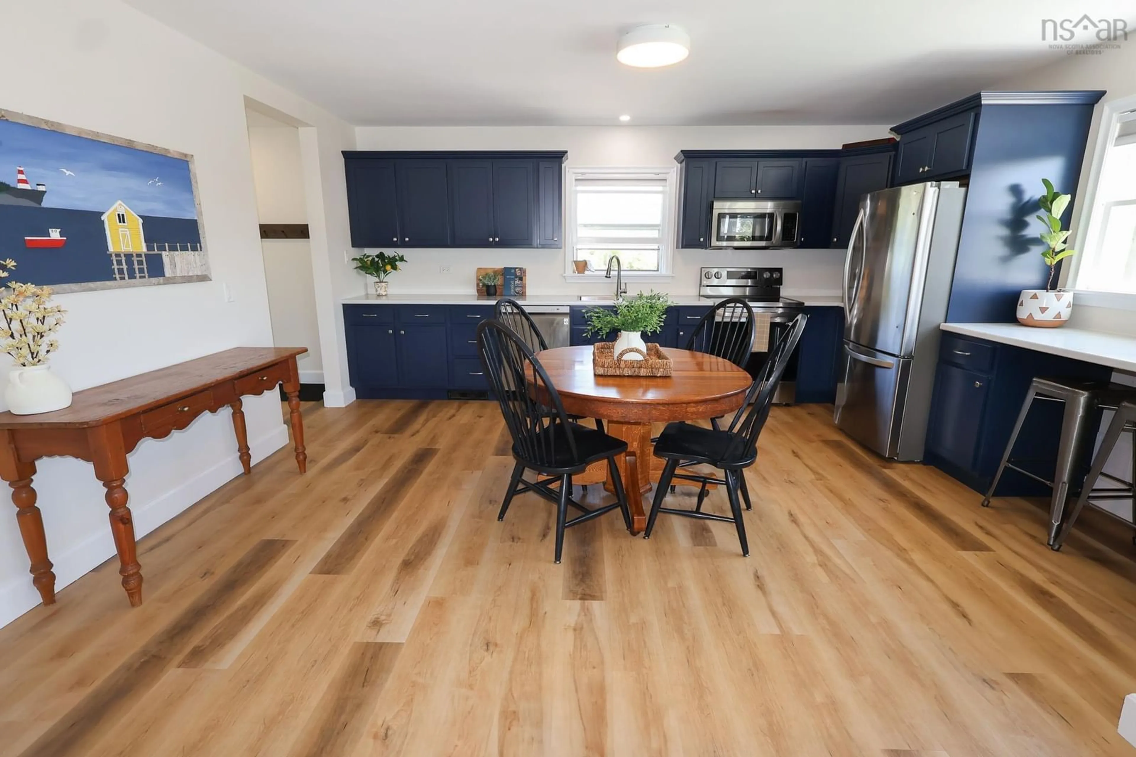 Open concept kitchen, wood/laminate floor for 353 Blue Rocks Rd, Garden Lots Nova Scotia B0J 2C0