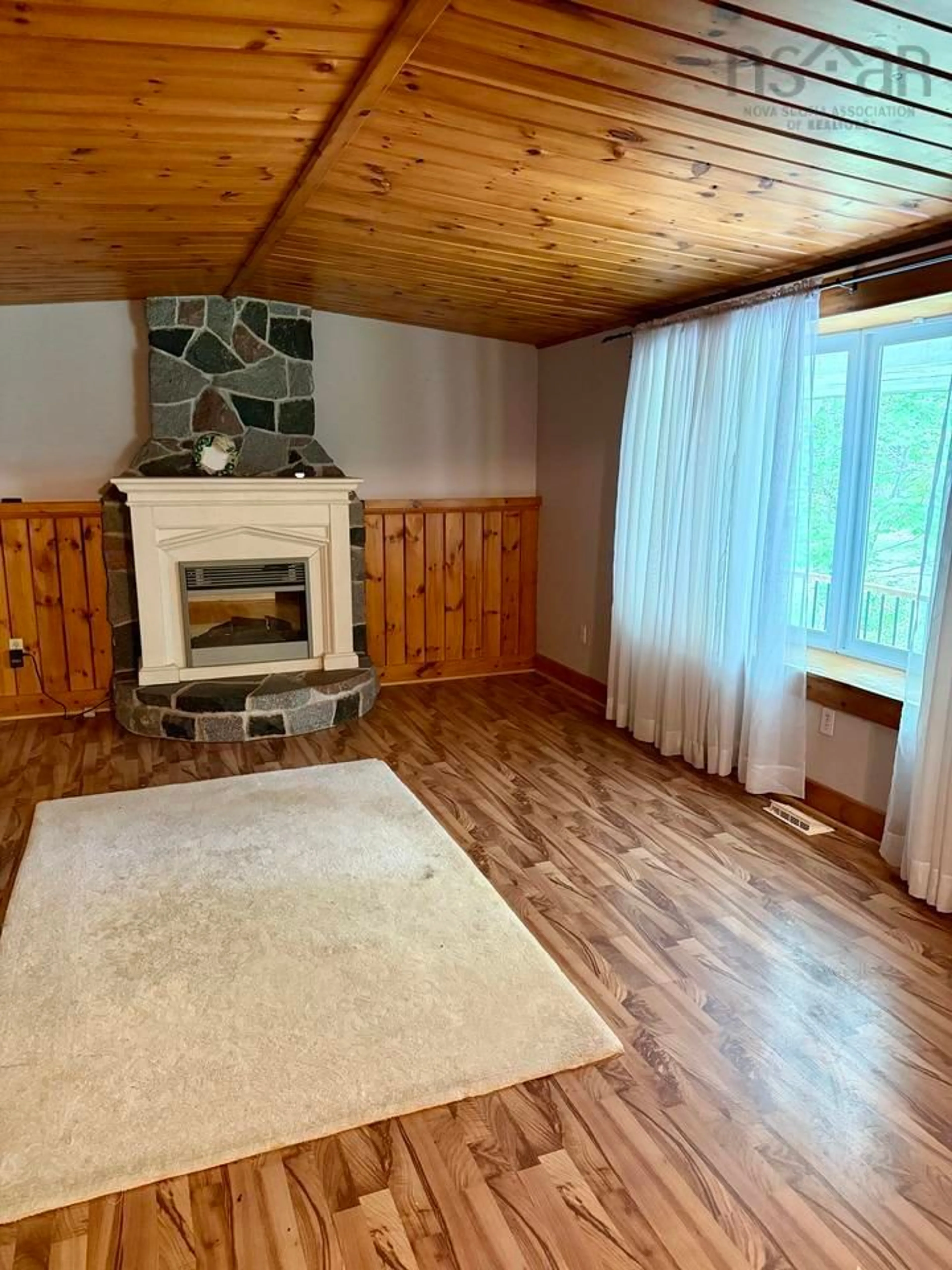 Living room with furniture, wood/laminate floor for 2853 South Rawdon Rd, South Rawdon Nova Scotia B0N 1Z0