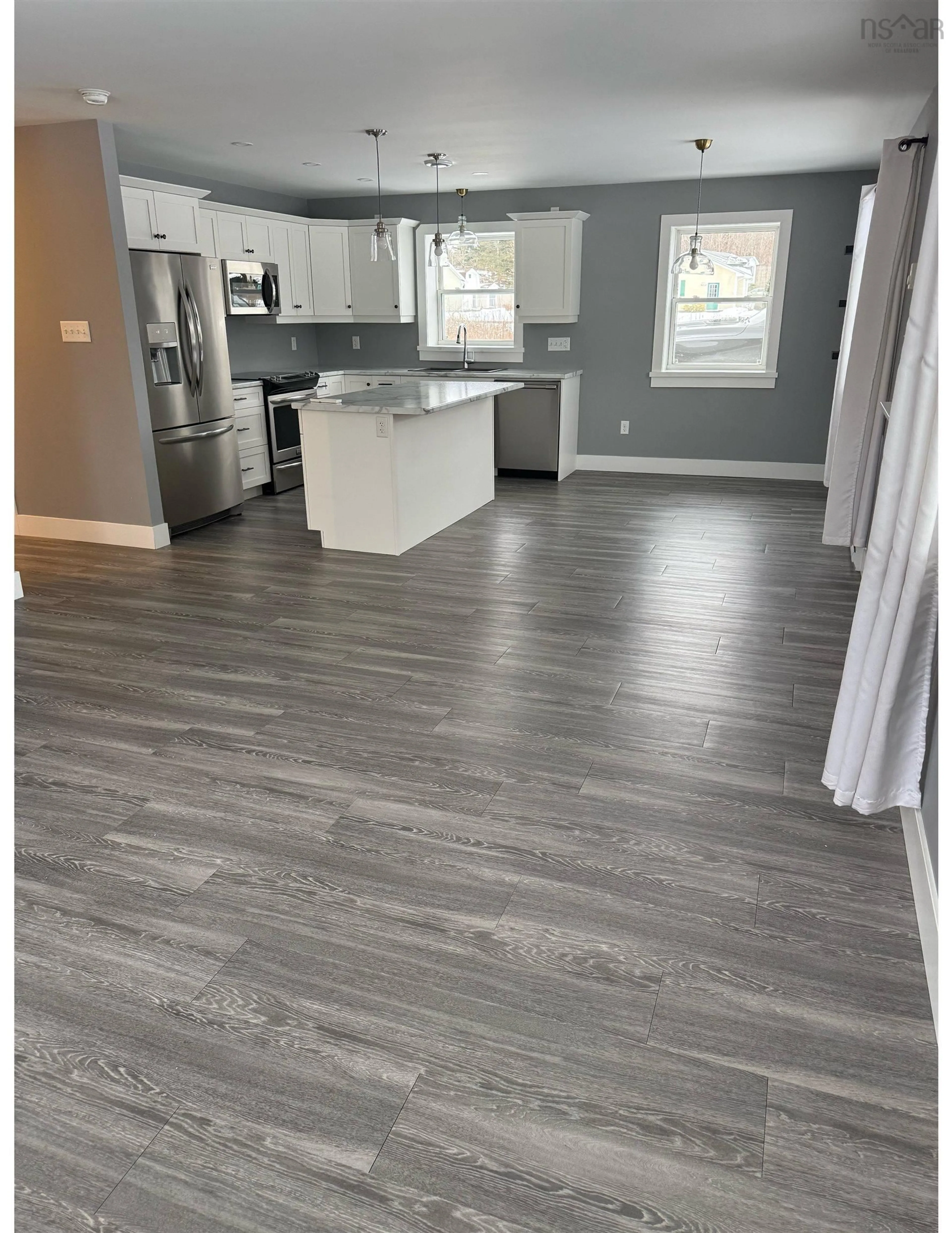 Open concept kitchen, wood/laminate floor for 984 Parkside Dr, Centreville Nova Scotia B0P 1J0