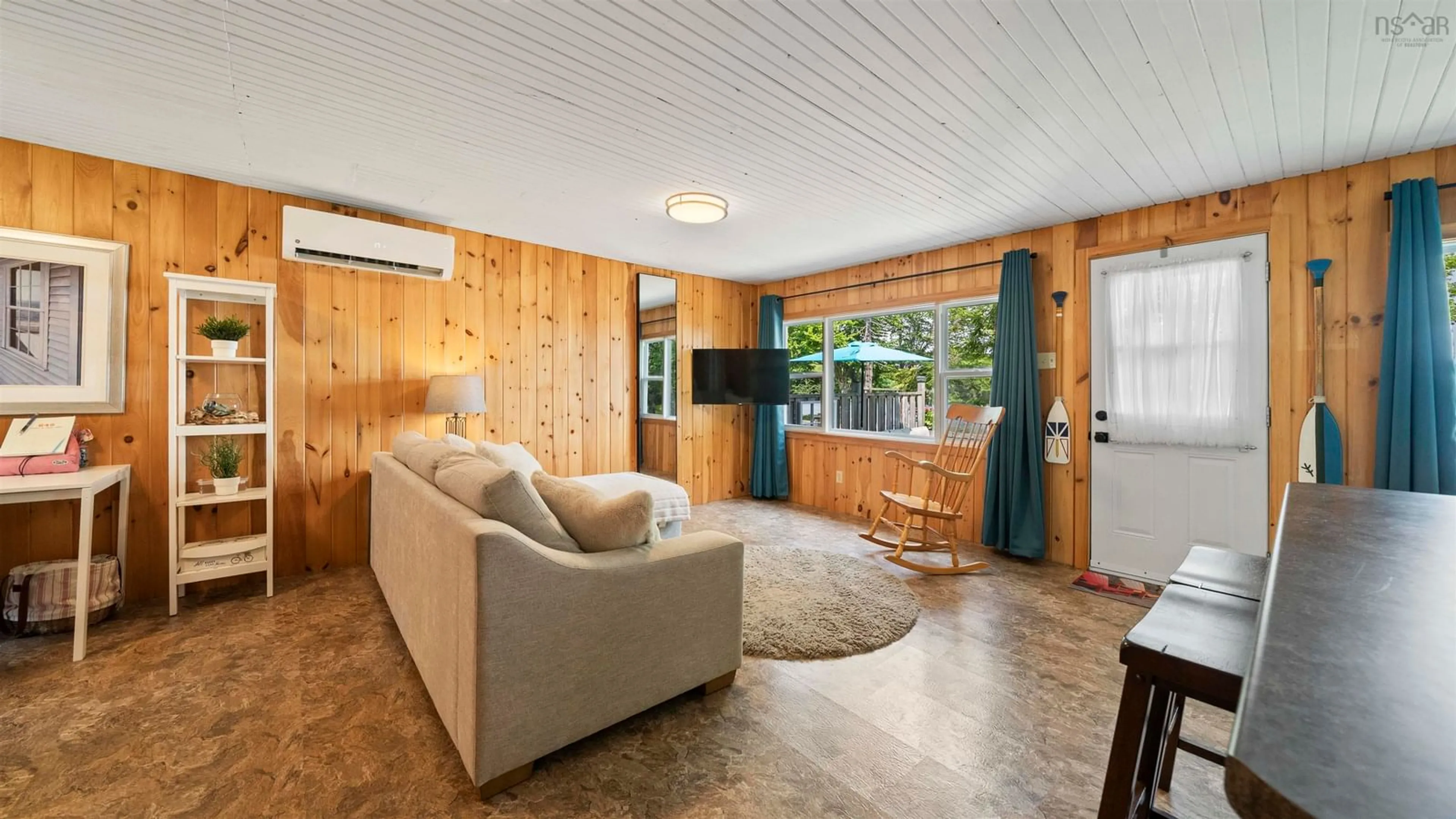 Living room with furniture, wood/laminate floor for 45 Crooked Lake Rd, Camperdown Nova Scotia B4V 6T3