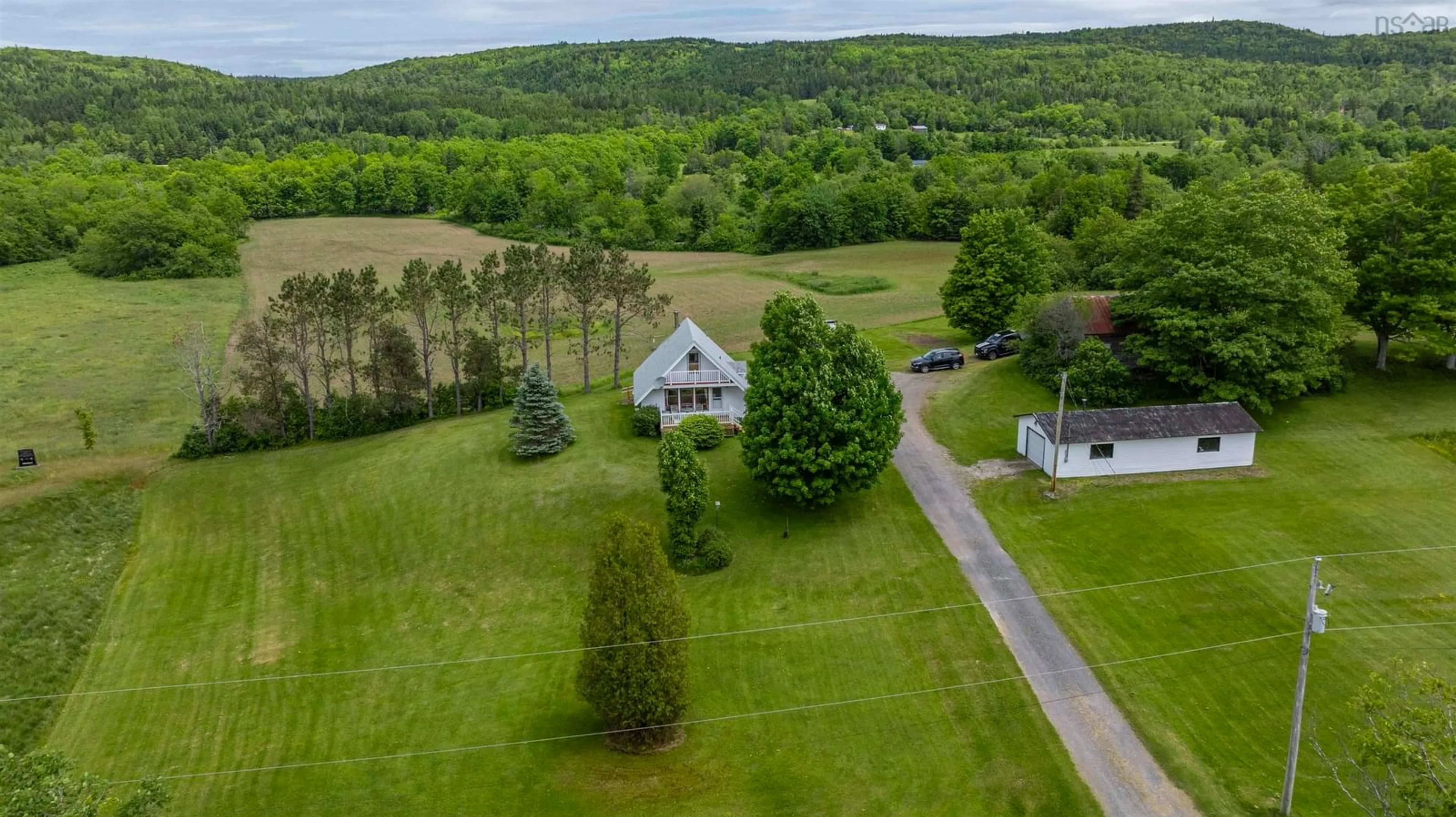A pic from outside/outdoor area/front of a property/back of a property/a pic from drone, water/lake/river/ocean view for 3350 East River West Side Rd, Glencoe Nova Scotia B0K 1B0
