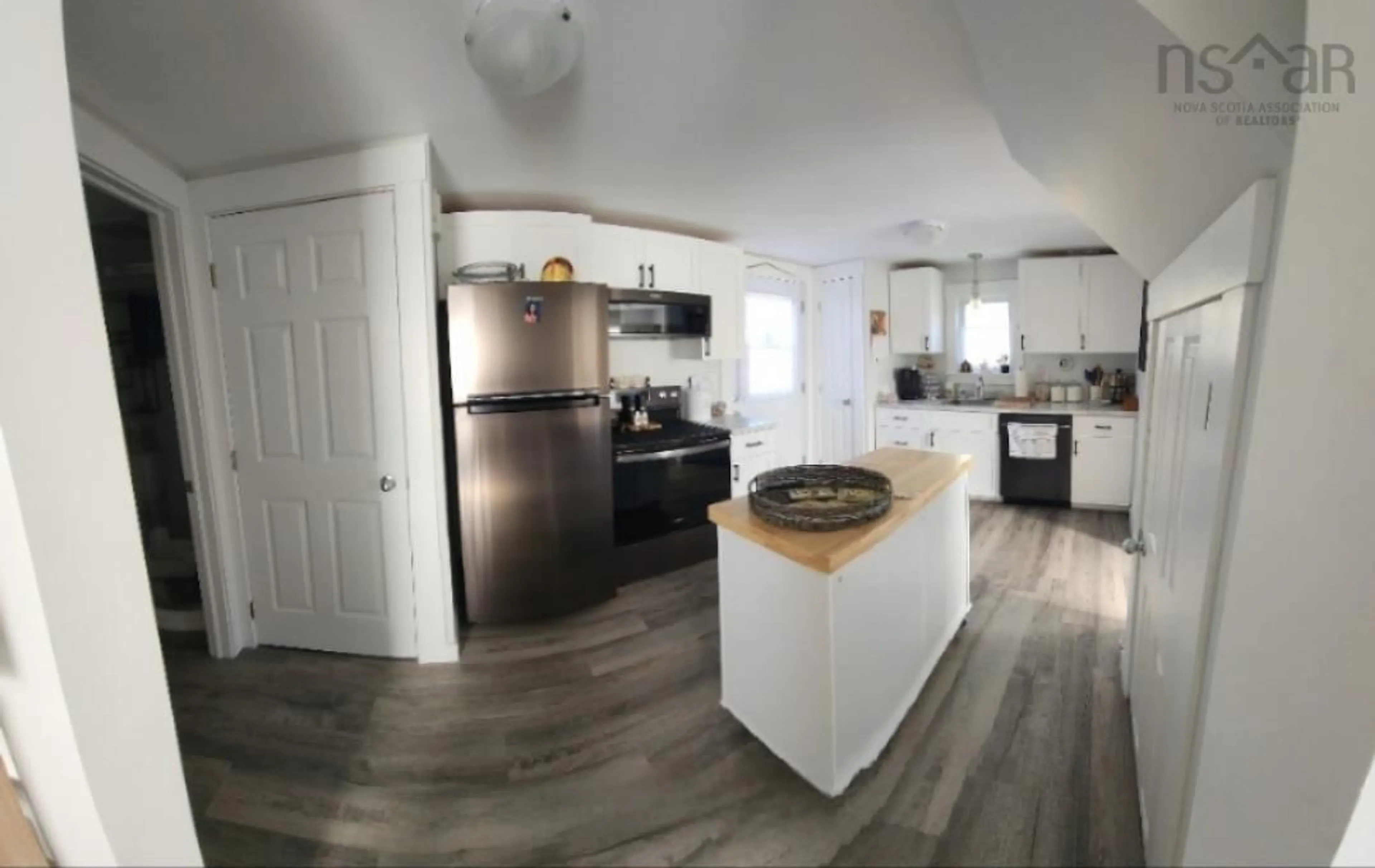 Open concept kitchen, wood/laminate floor for 2005 East Prince St, Salmon River Nova Scotia B2N 1K2