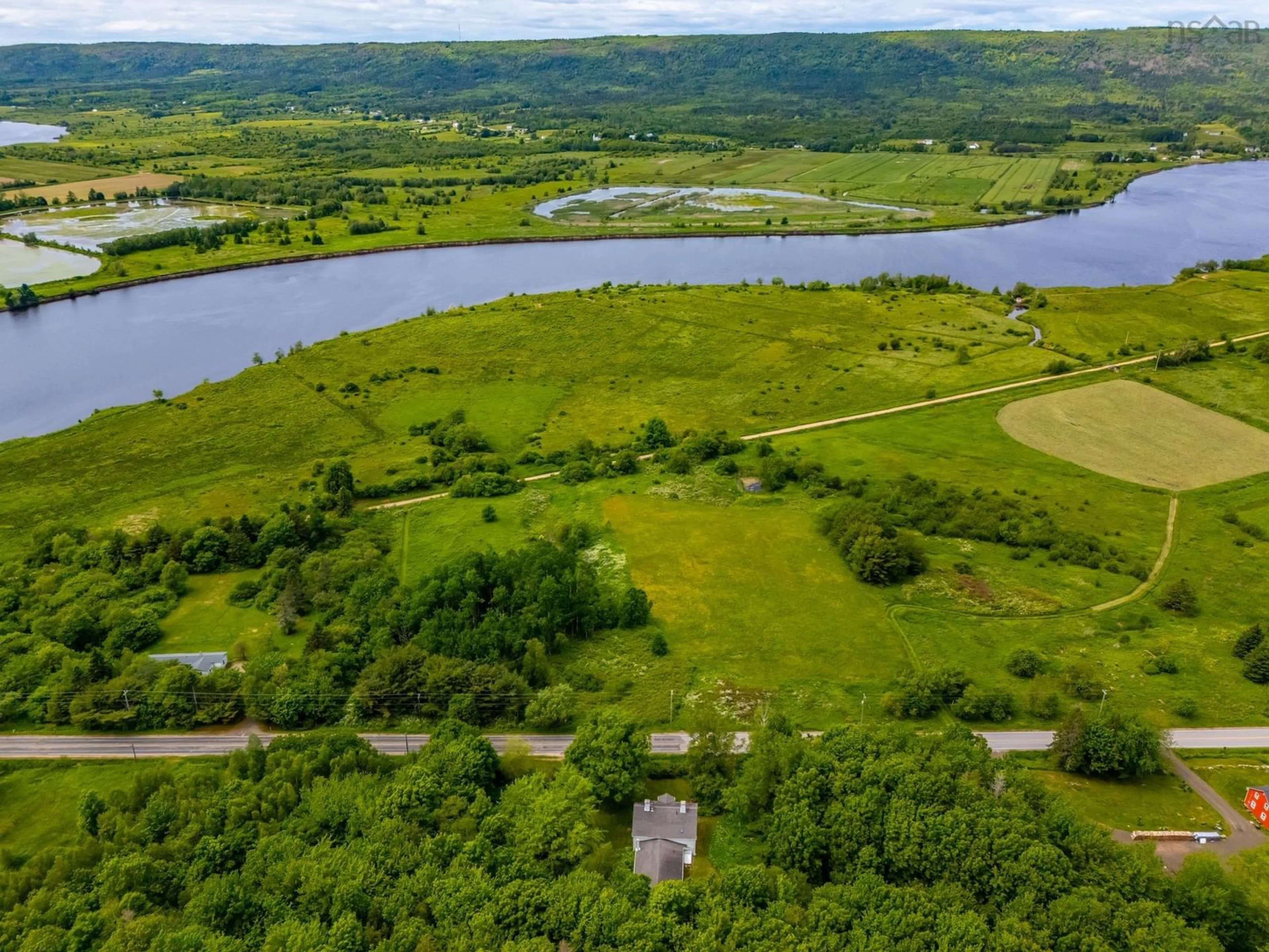 A pic from outside/outdoor area/front of a property/back of a property/a pic from drone, water/lake/river/ocean view for 2386 Highway 201, Tupperville Nova Scotia B0S 1C0