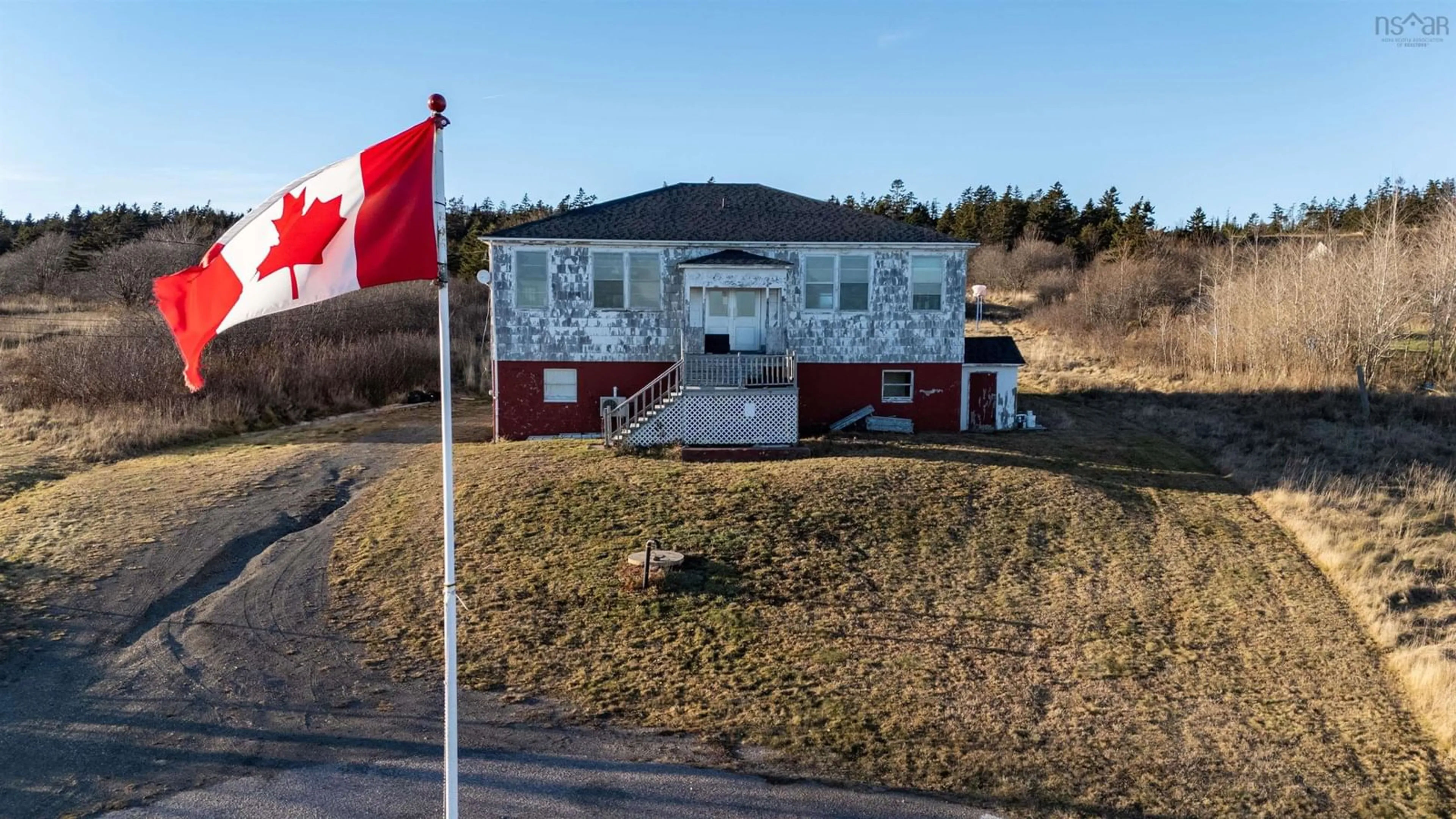 A pic from outside/outdoor area/front of a property/back of a property/a pic from drone, building for 63 Second Street, Westport Nova Scotia B0V 1H0