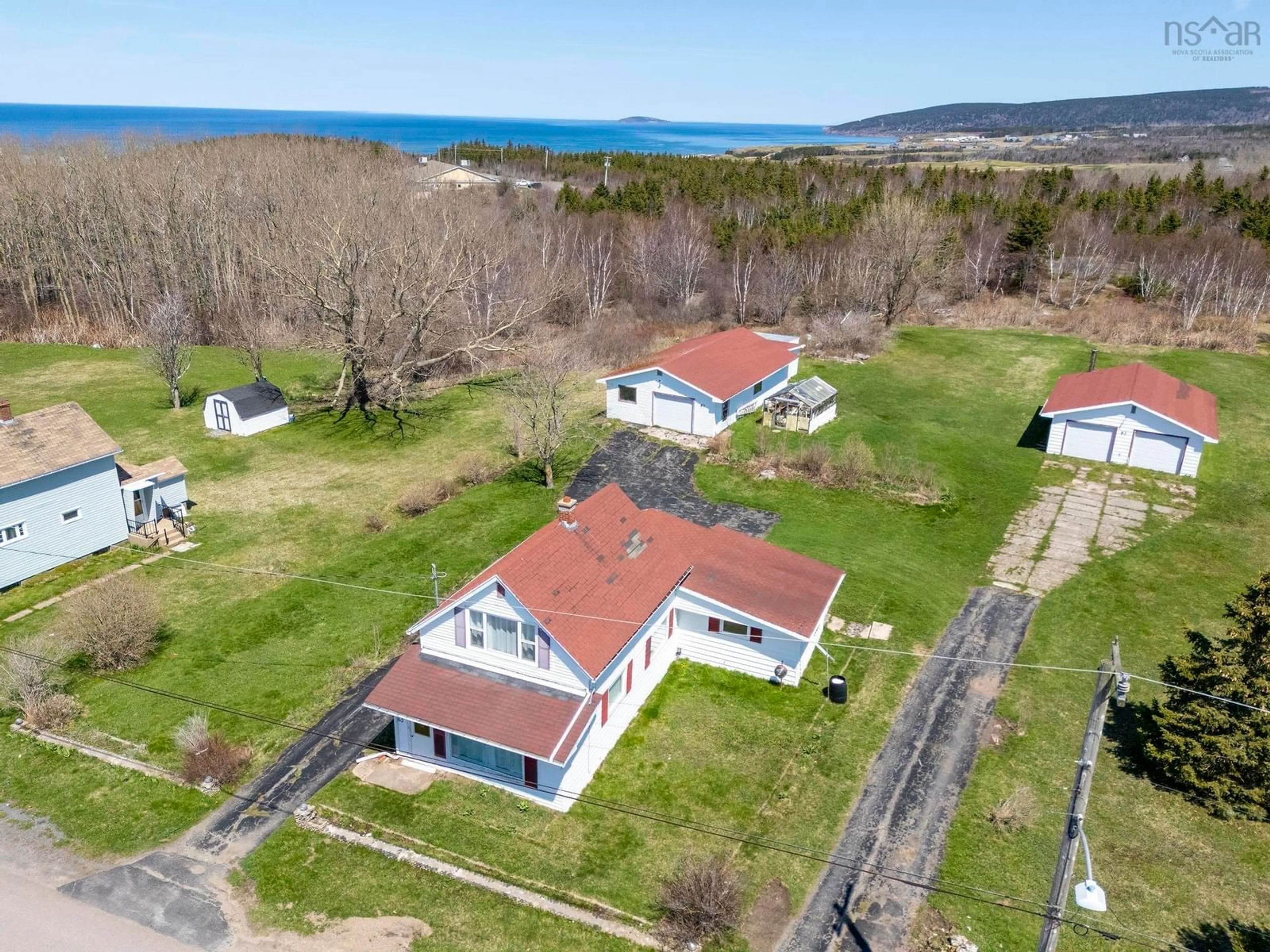 A pic from outside/outdoor area/front of a property/back of a property/a pic from drone, water/lake/river/ocean view for 63 Maclean St, Inverness Nova Scotia B0E 1N0