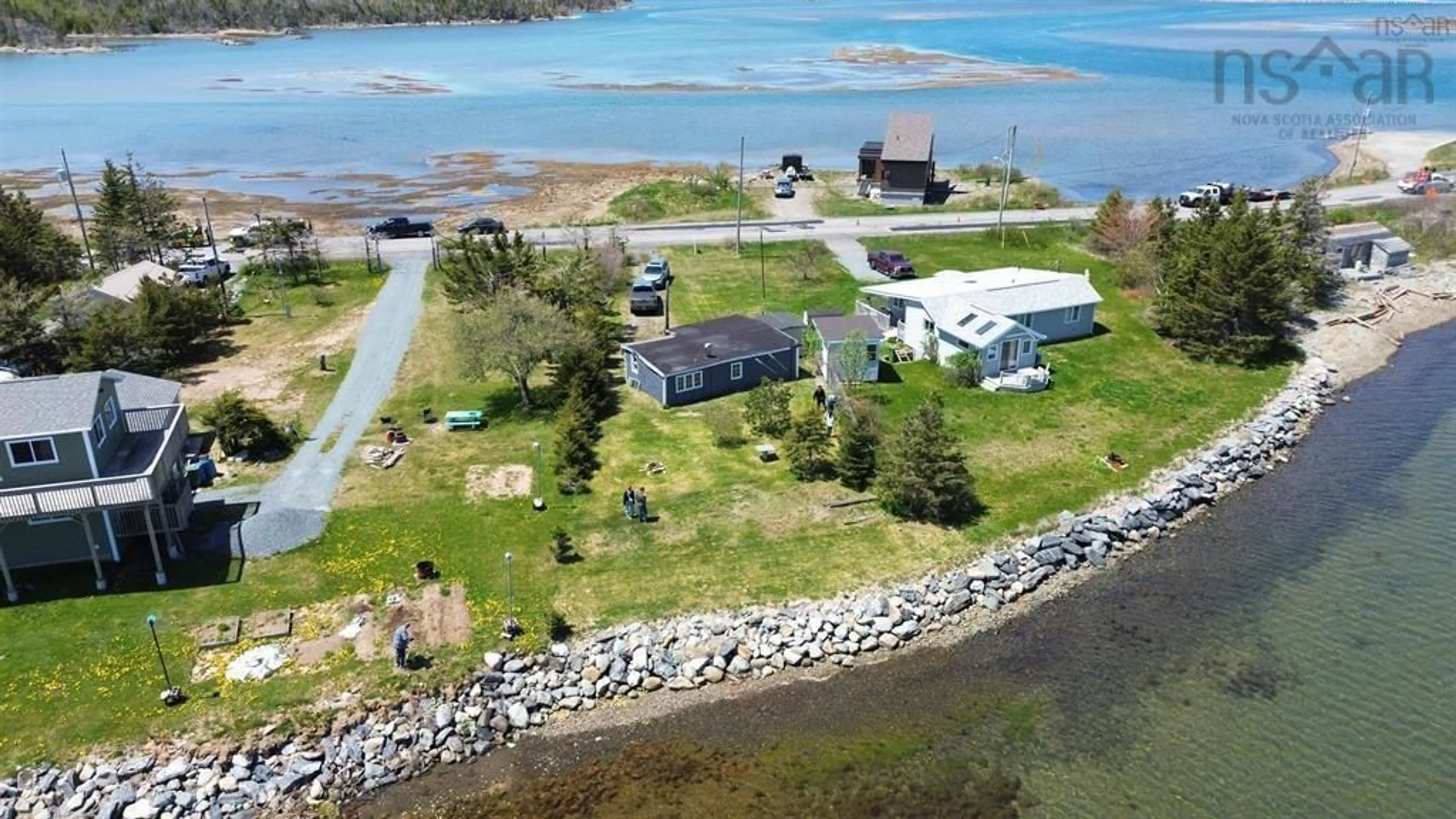 A pic from outside/outdoor area/front of a property/back of a property/a pic from drone, water/lake/river/ocean view for 2353 Cow Bay Rd, Cow Bay Nova Scotia B3G 1K8