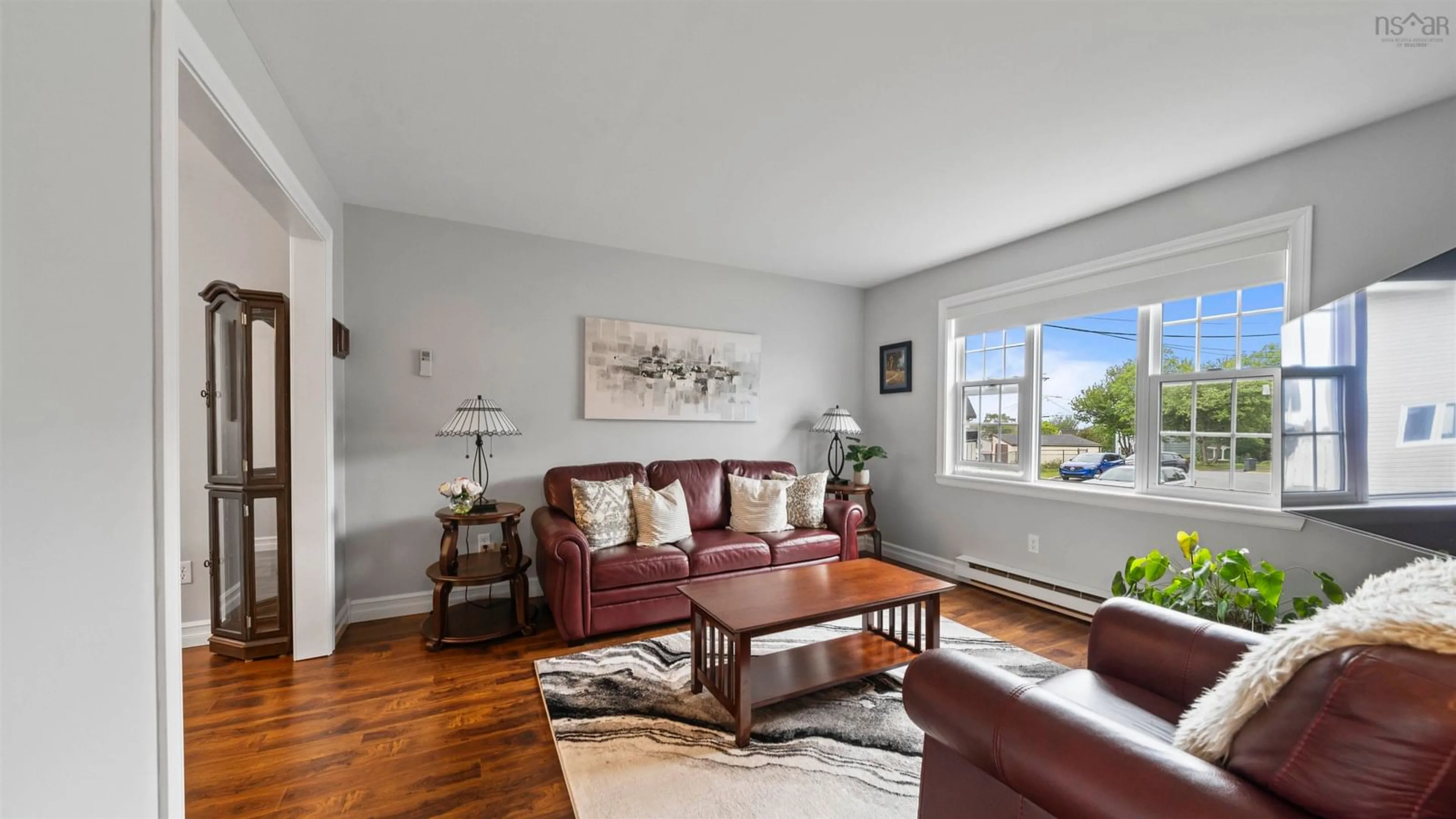 Living room with furniture, wood/laminate floor for 32 Osborne Ave, Dartmouth Nova Scotia B2W 1H8