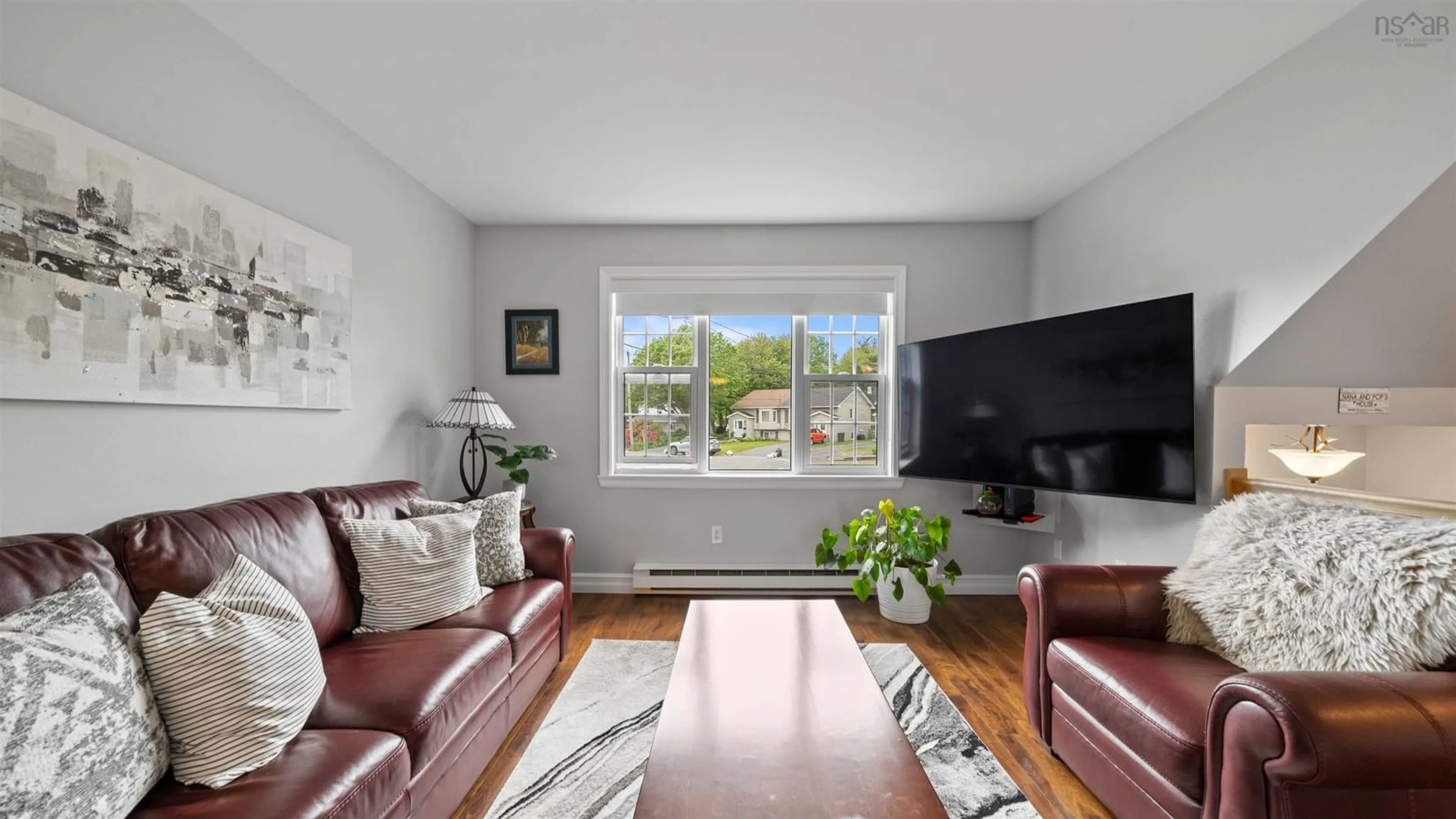Living room with furniture, wood/laminate floor for 32 Osborne Ave, Dartmouth Nova Scotia B2W 1H8