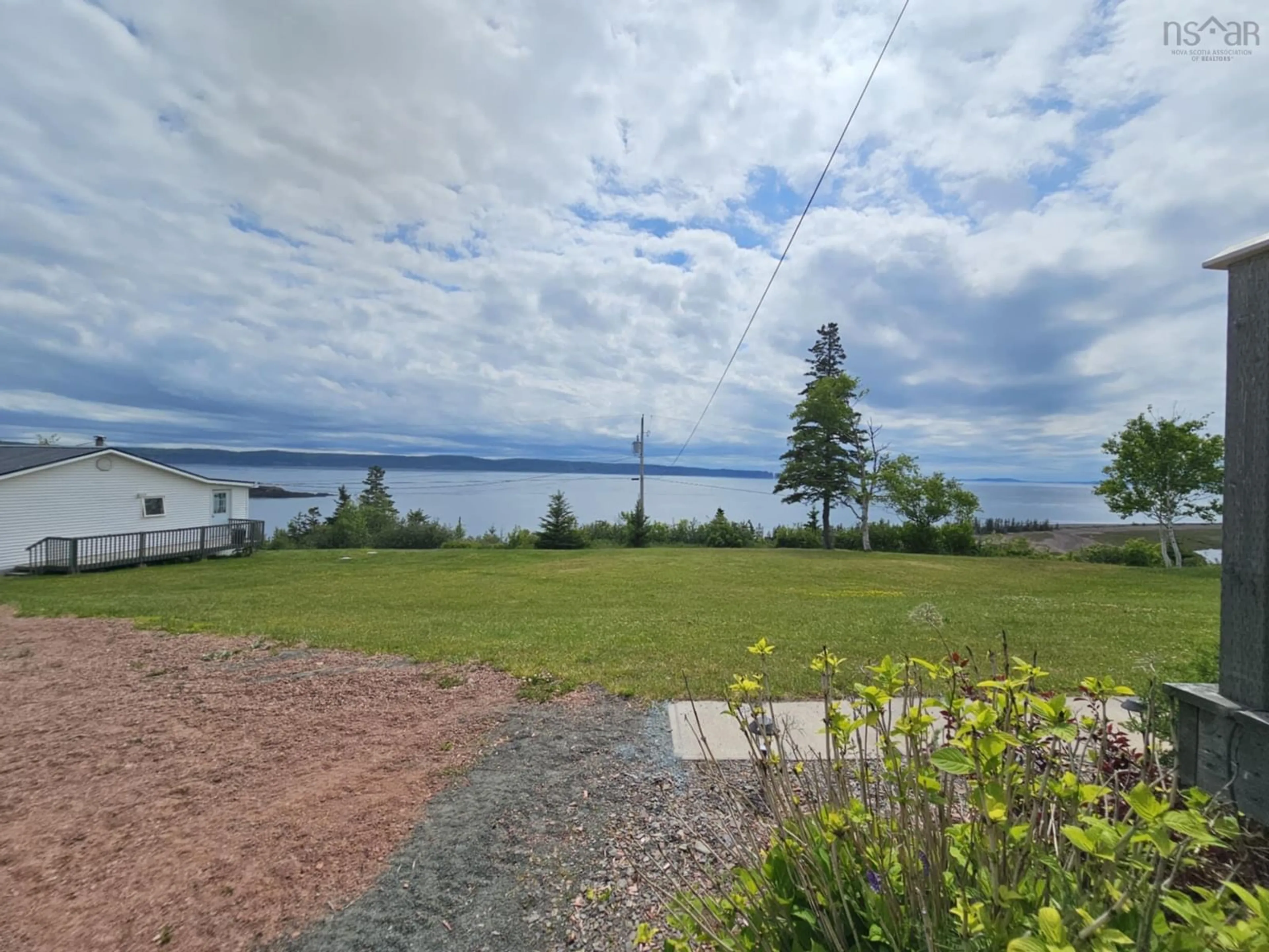 A pic from outside/outdoor area/front of a property/back of a property/a pic from drone, water/lake/river/ocean view for 987 West Bay Road, Parrsboro Nova Scotia B0M 1S0