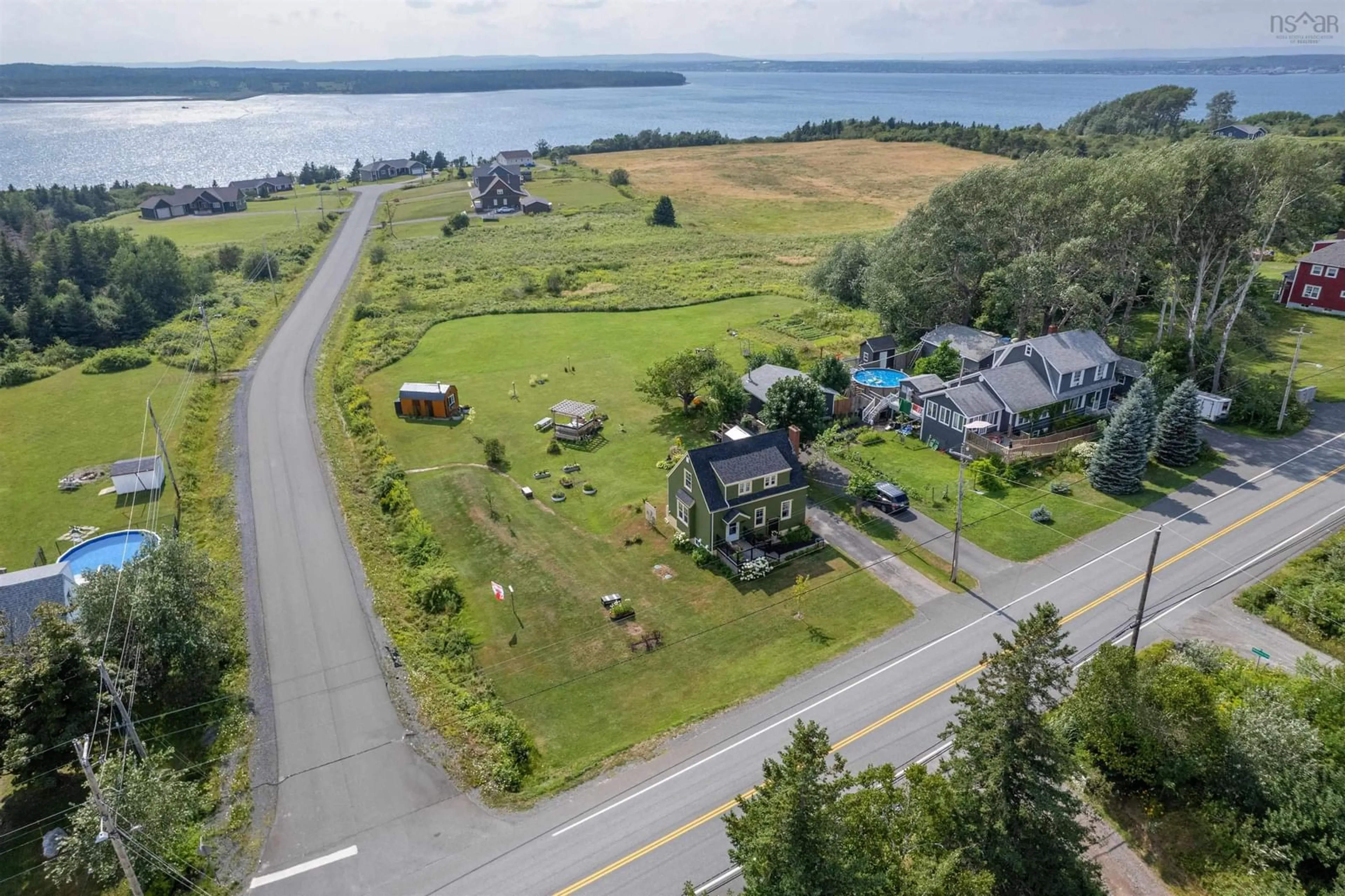 A pic from outside/outdoor area/front of a property/back of a property/a pic from drone, water/lake/river/ocean view for 2021 Highway 28 Hwy, South Bar Nova Scotia B1N 3H8
