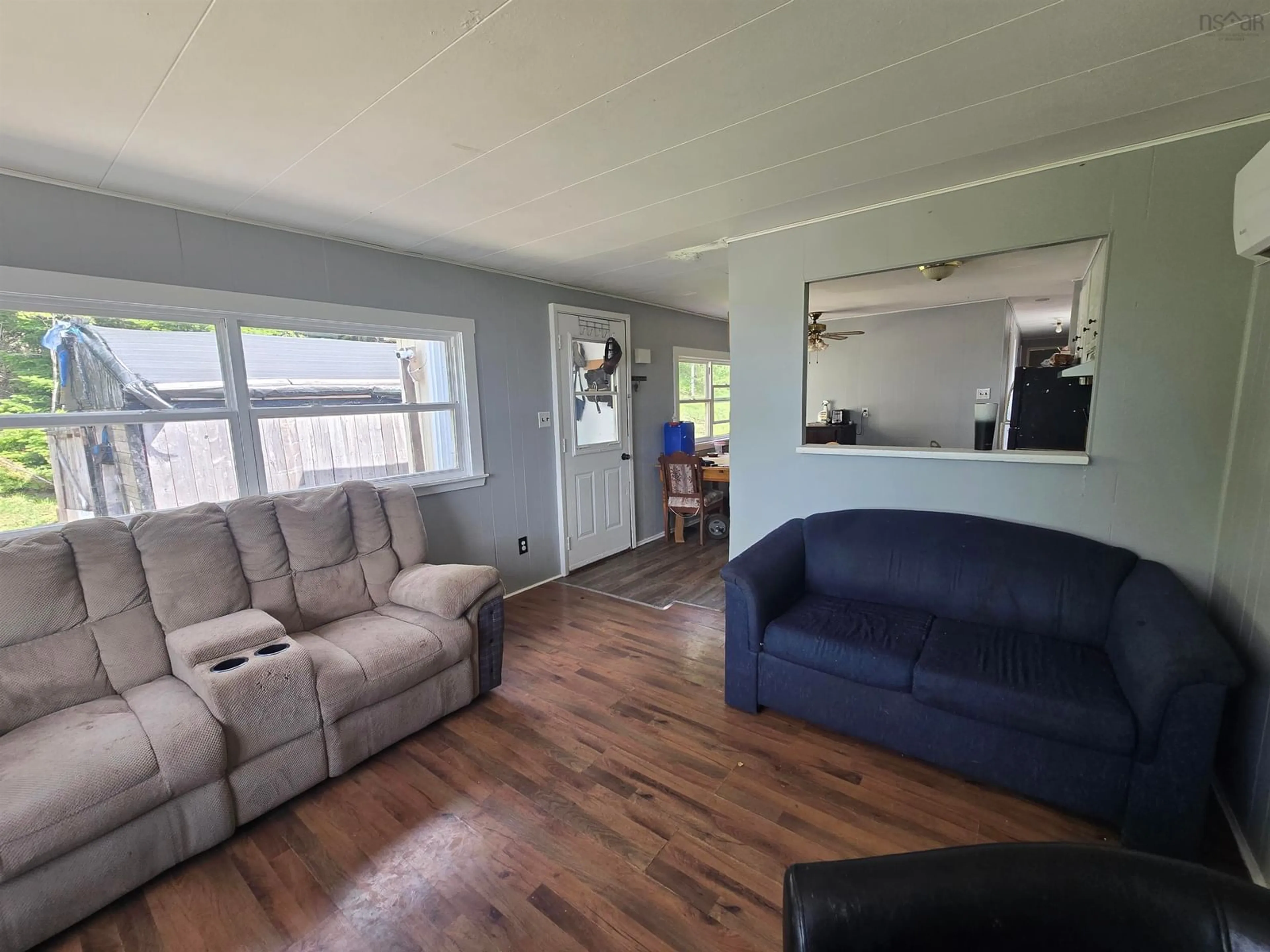 Living room with furniture, wood/laminate floor for 43 C-20 Road, Lower South River Nova Scotia B2G 2L4