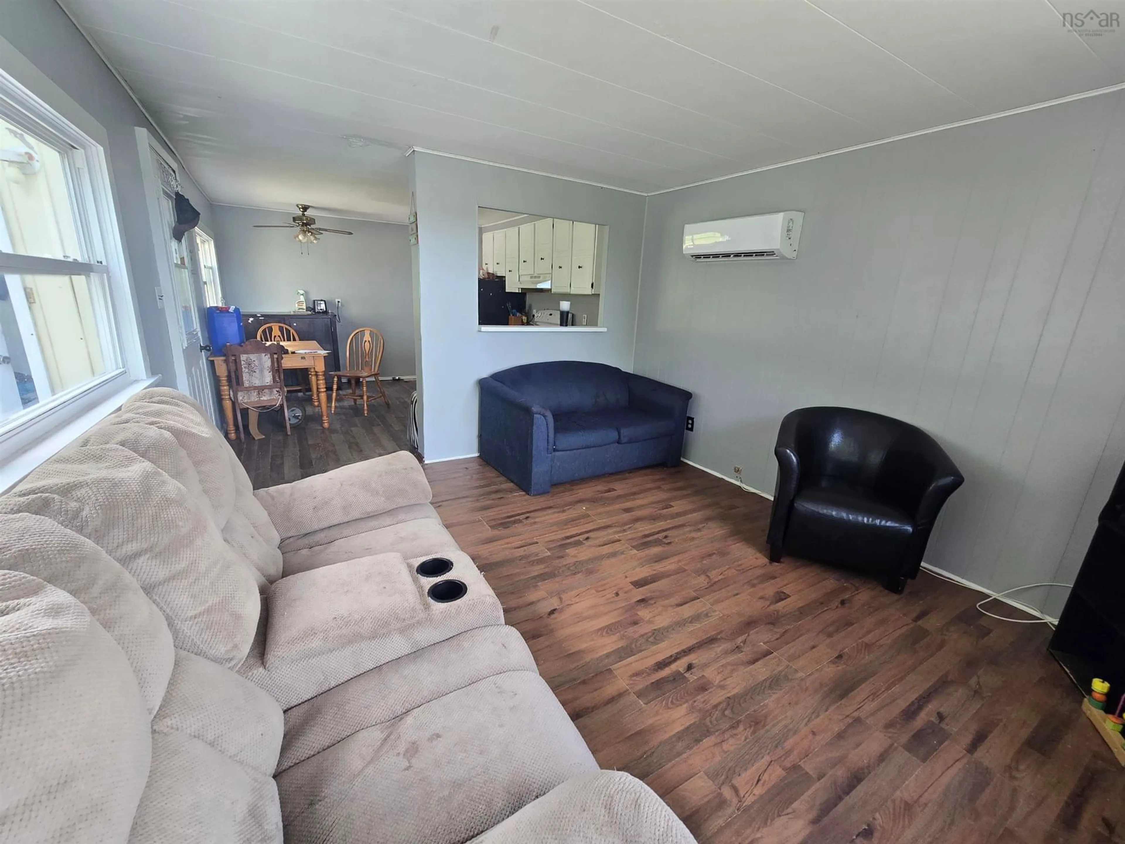 Living room with furniture, wood/laminate floor for 43 C-20 Road, Lower South River Nova Scotia B2G 2L4