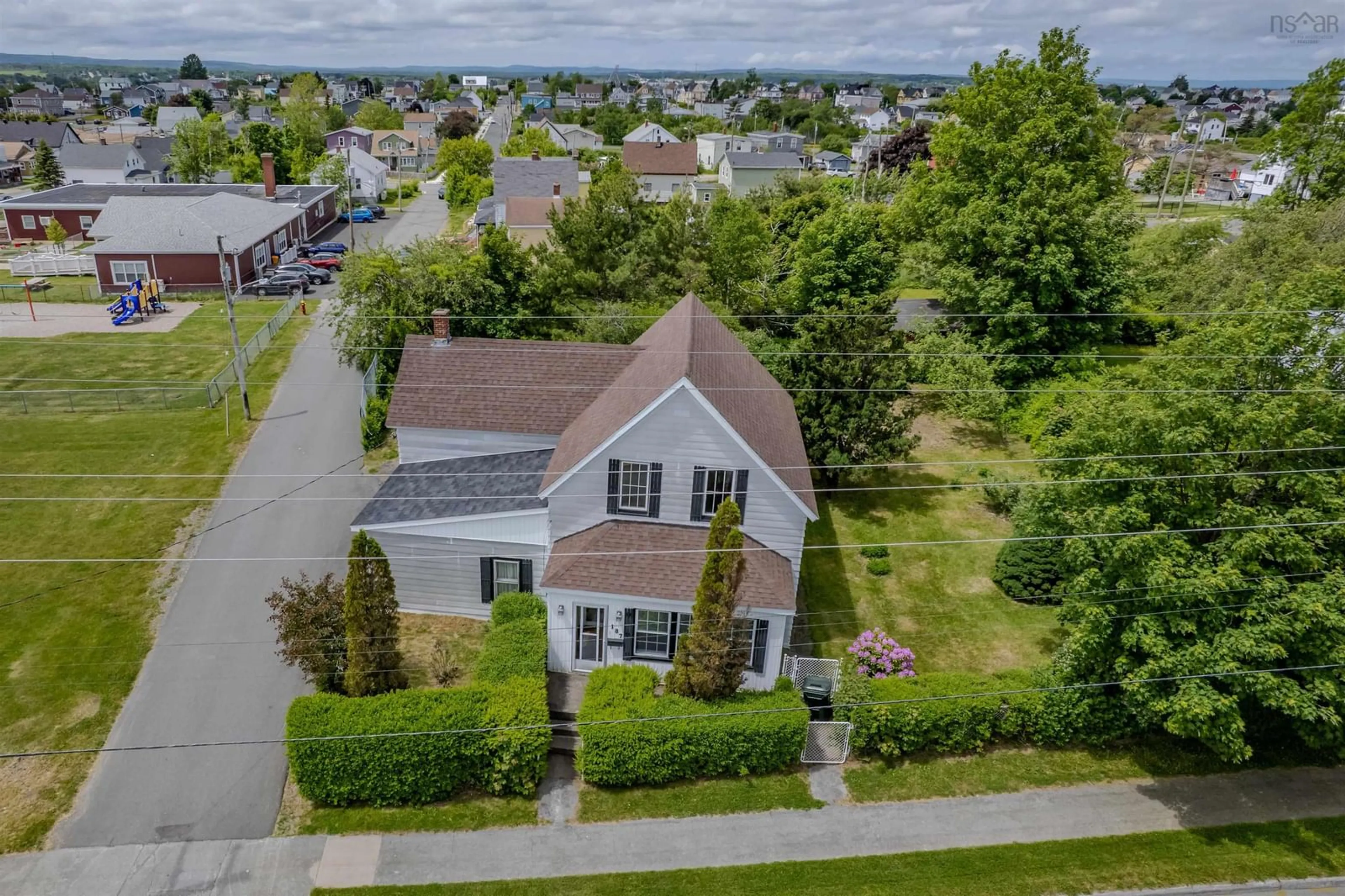 A pic from outside/outdoor area/front of a property/back of a property/a pic from drone, street for 187 Lingan Rd, Sydney Nova Scotia B1N 1V7