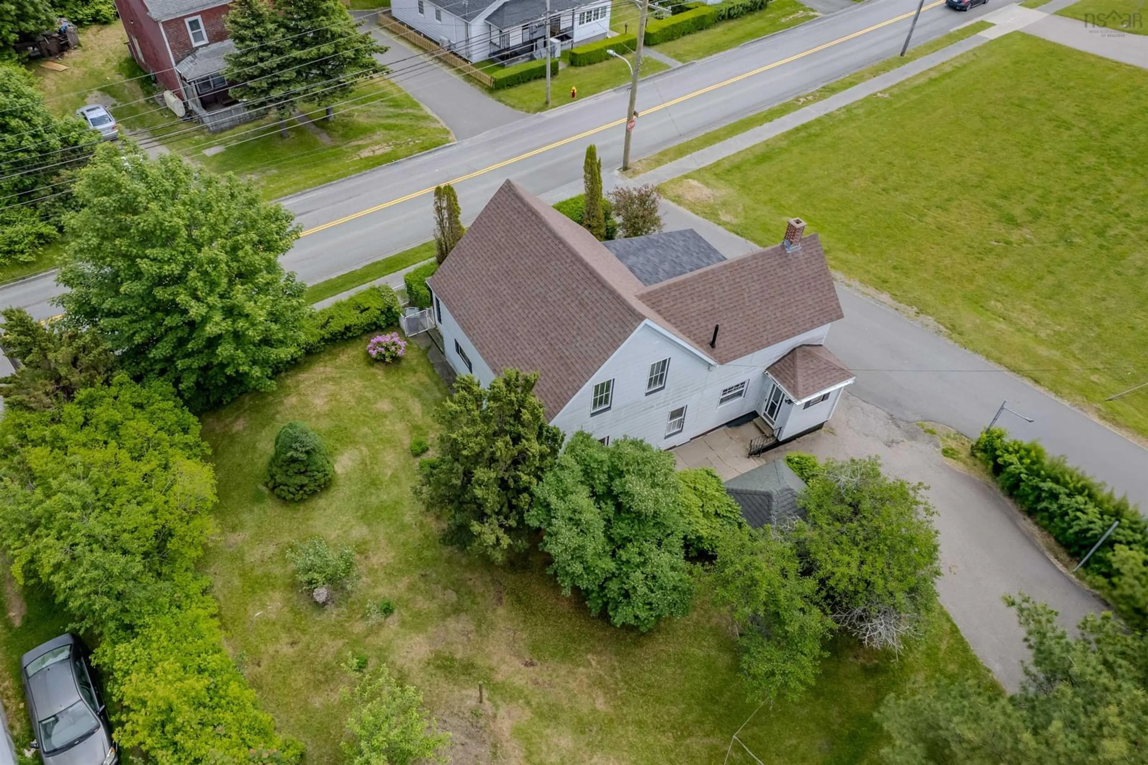 A pic from outside/outdoor area/front of a property/back of a property/a pic from drone, street for 187 Lingan Rd, Sydney Nova Scotia B1N 1V7