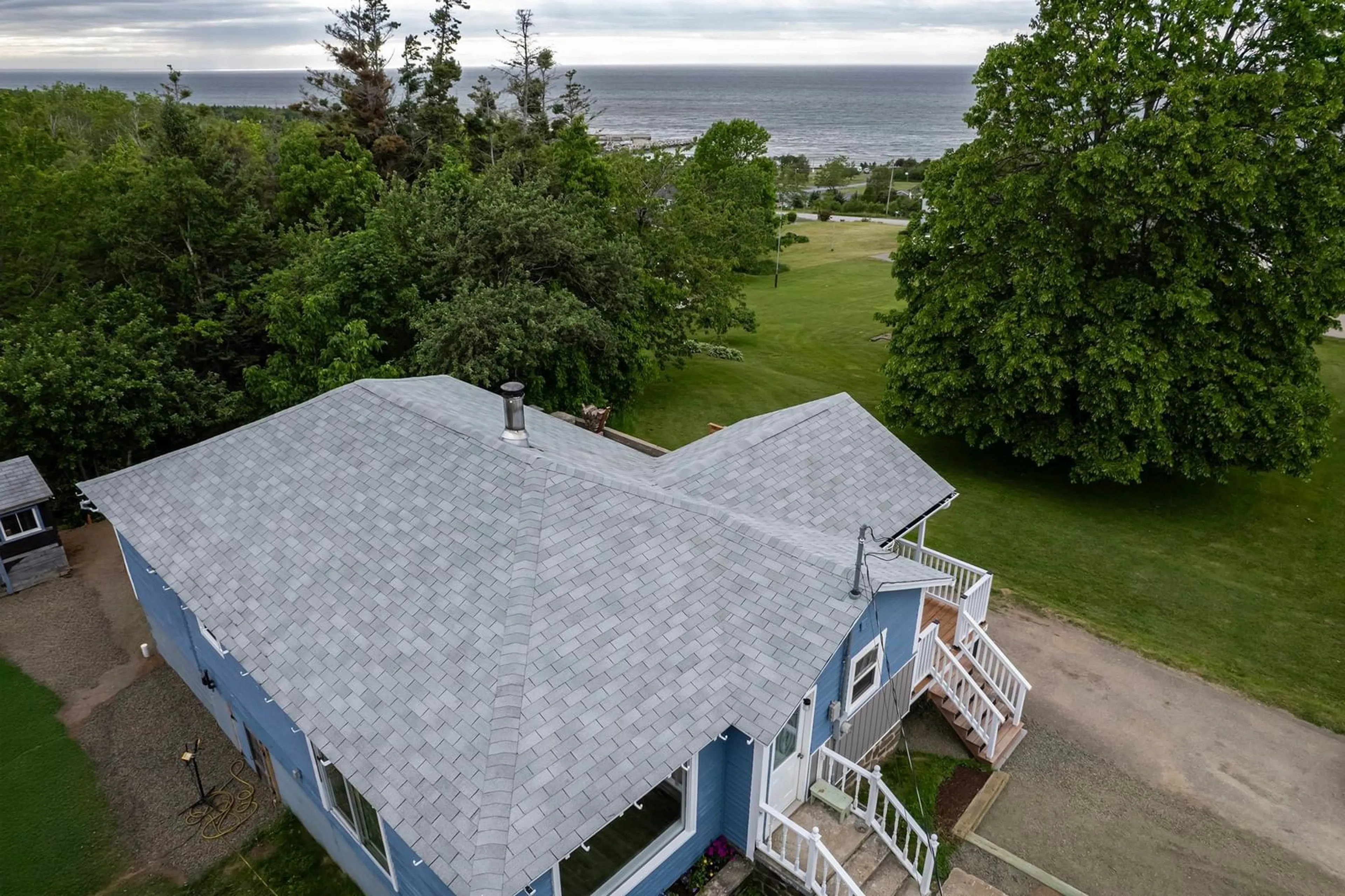 A pic from outside/outdoor area/front of a property/back of a property/a pic from drone, water/lake/river/ocean view for 1207 Parker Mountain Rd, Parkers Cove Nova Scotia B0S 1A0