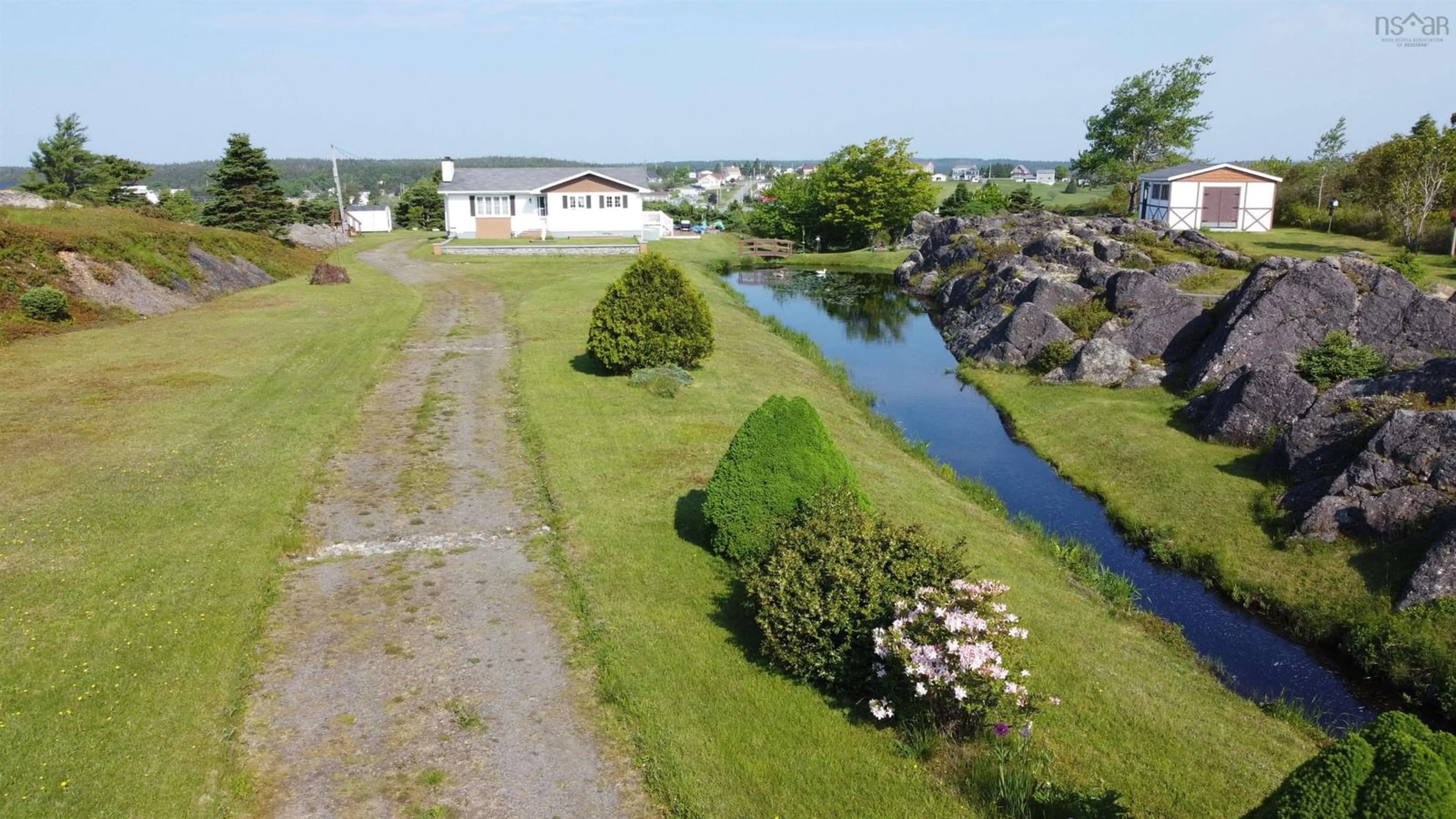 A pic from outside/outdoor area/front of a property/back of a property/a pic from drone, water/lake/river/ocean view for 3817 Highway 206, Petit-De-Grat Nova Scotia B0E 2L0