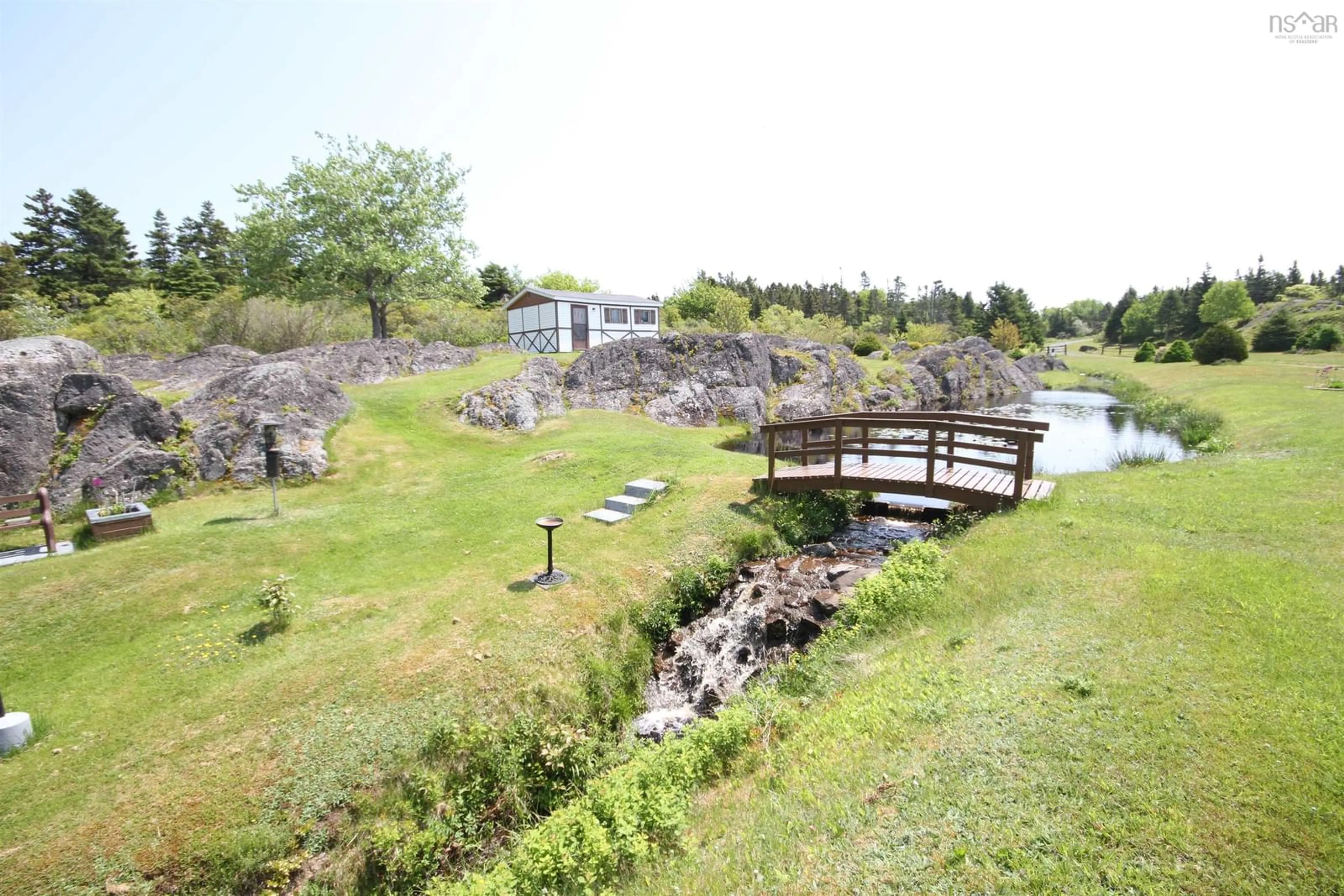 A pic from outside/outdoor area/front of a property/back of a property/a pic from drone, water/lake/river/ocean view for 3817 Highway 206, Petit-De-Grat Nova Scotia B0E 2L0