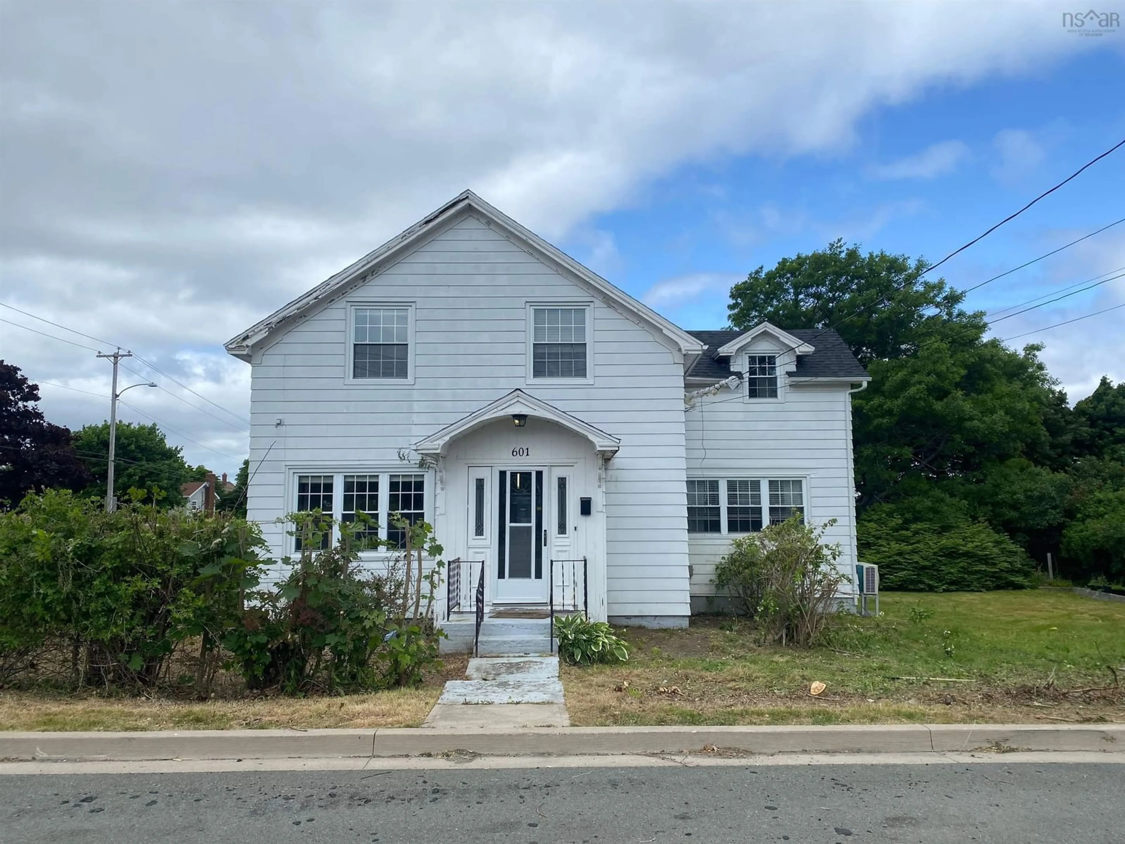 A pic from outside/outdoor area/front of a property/back of a property/a pic from drone, building for 601 George St, New Waterford Nova Scotia B1H 4E4