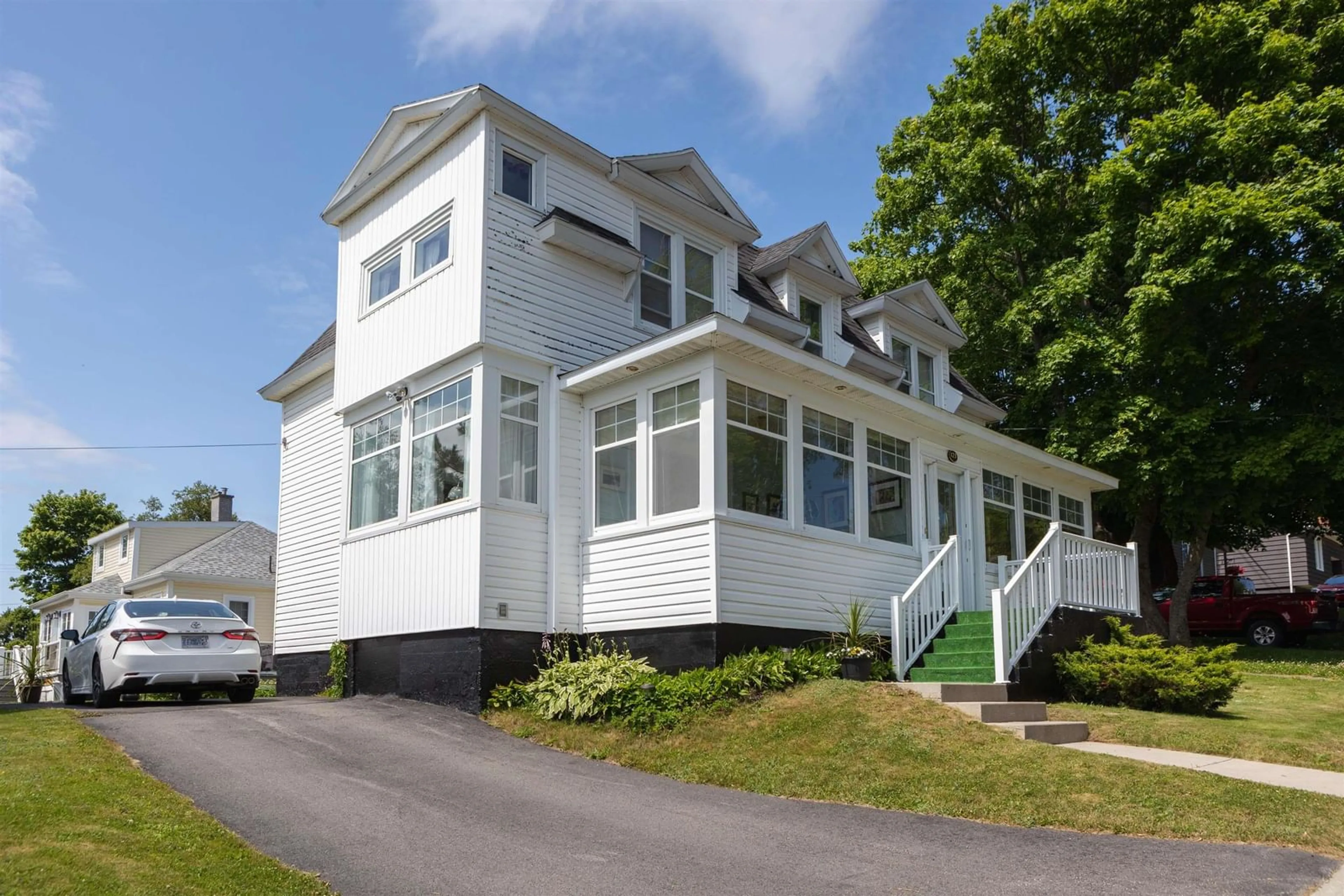 Home with vinyl exterior material, street for 123 Royal Ave, Sydney Nova Scotia B1P 4M4