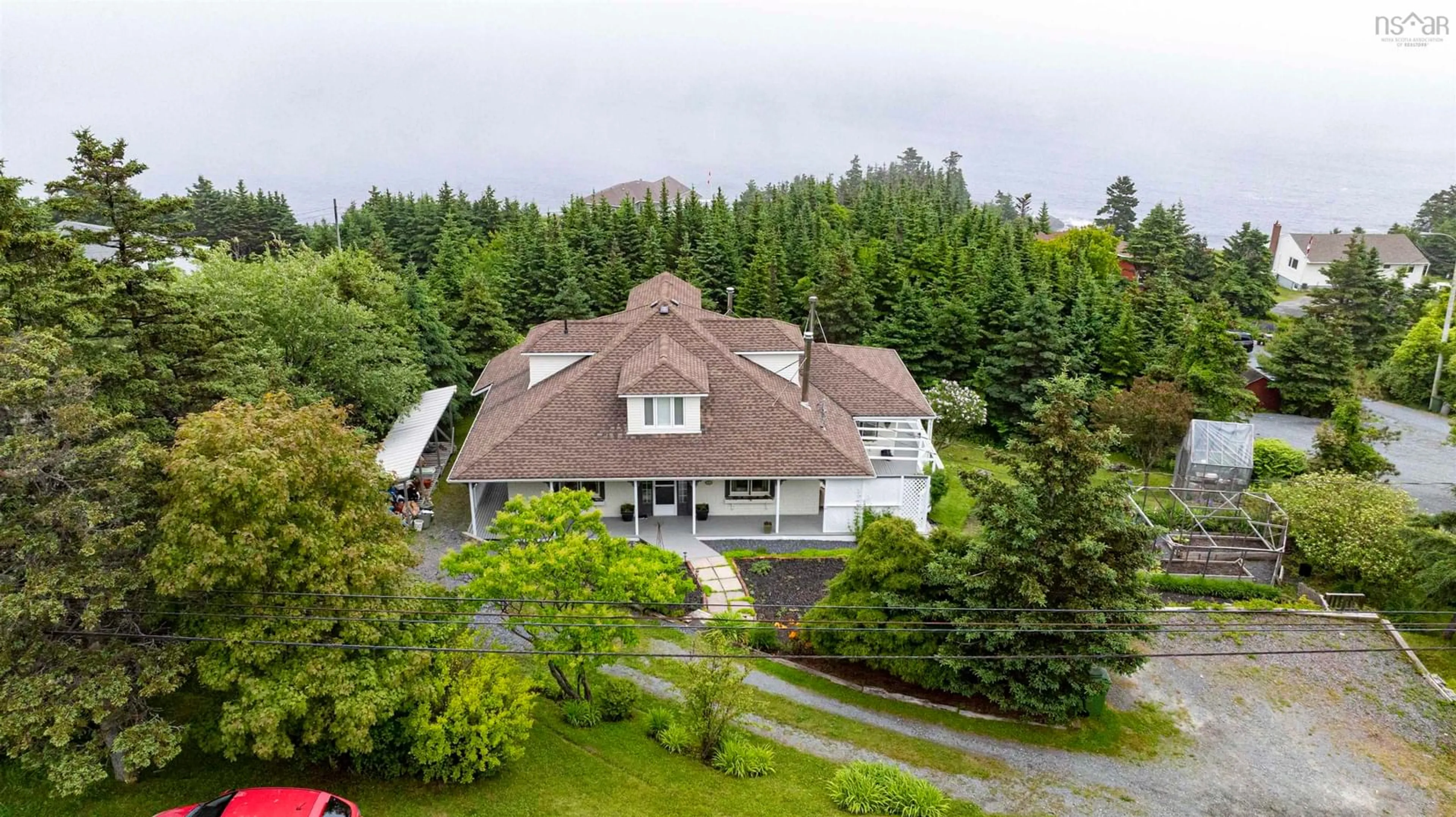 A pic from outside/outdoor area/front of a property/back of a property/a pic from drone, mountain view for 650 Ketch Harbour Rd, Portuguese Cove Nova Scotia B3V 1K1
