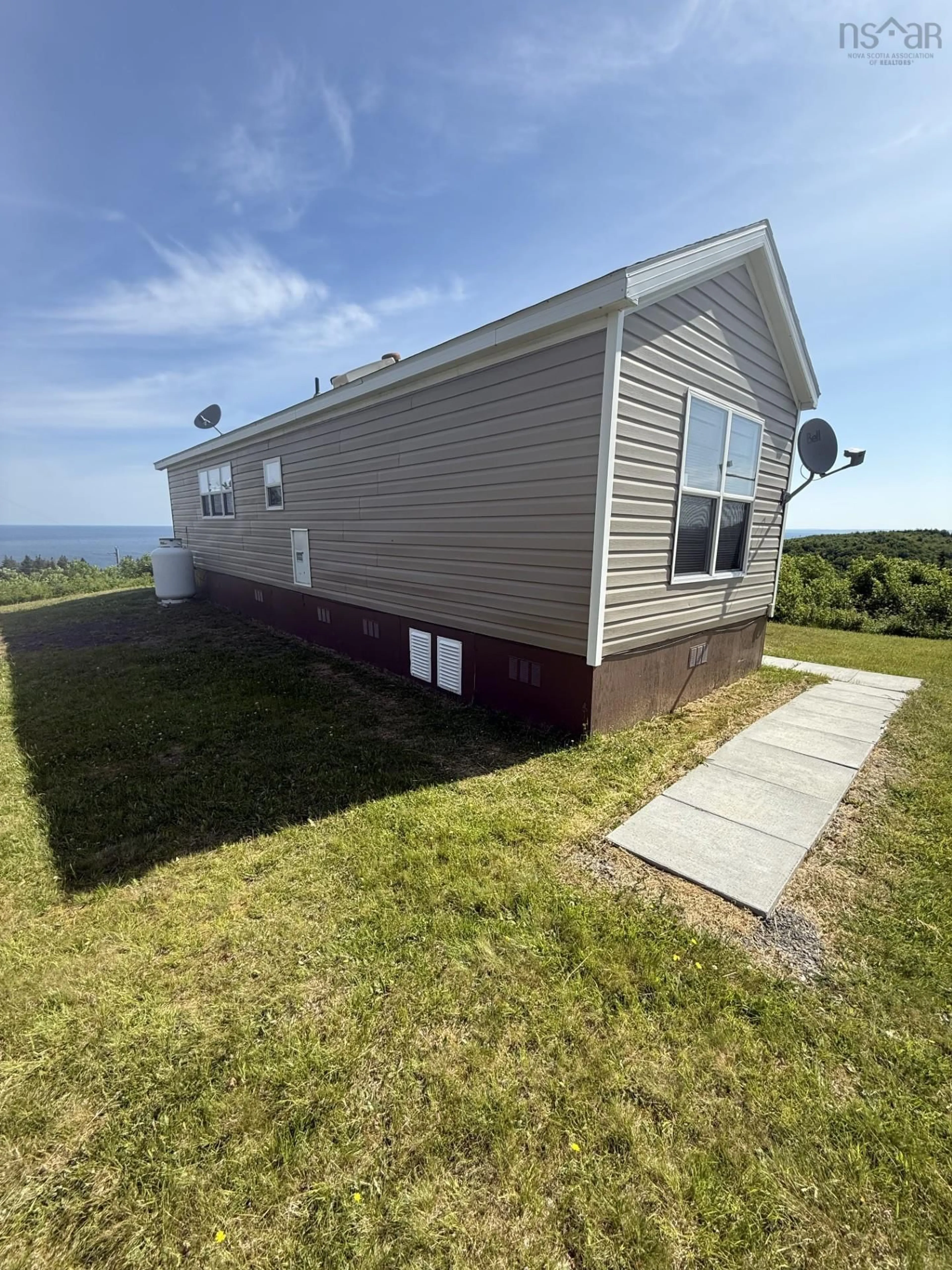 Home with vinyl exterior material, water/lake/river/ocean view for 7047 Highway 337 Cape George Point, Cape George Point Nova Scotia B2G 2L2