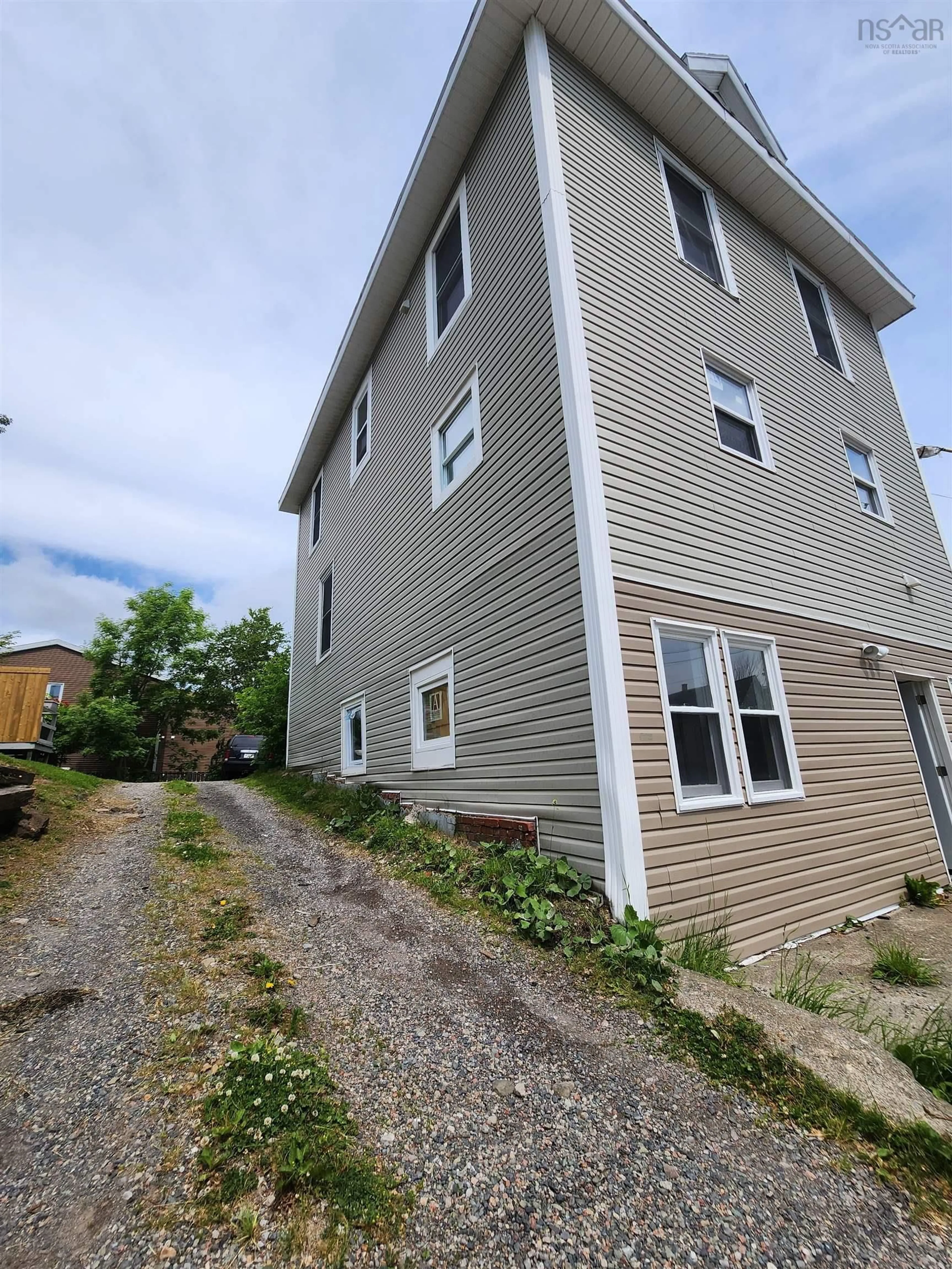 Home with vinyl exterior material, street for 17 Ferry St, Cape Breton Island Nova Scotia B1P 5Z9