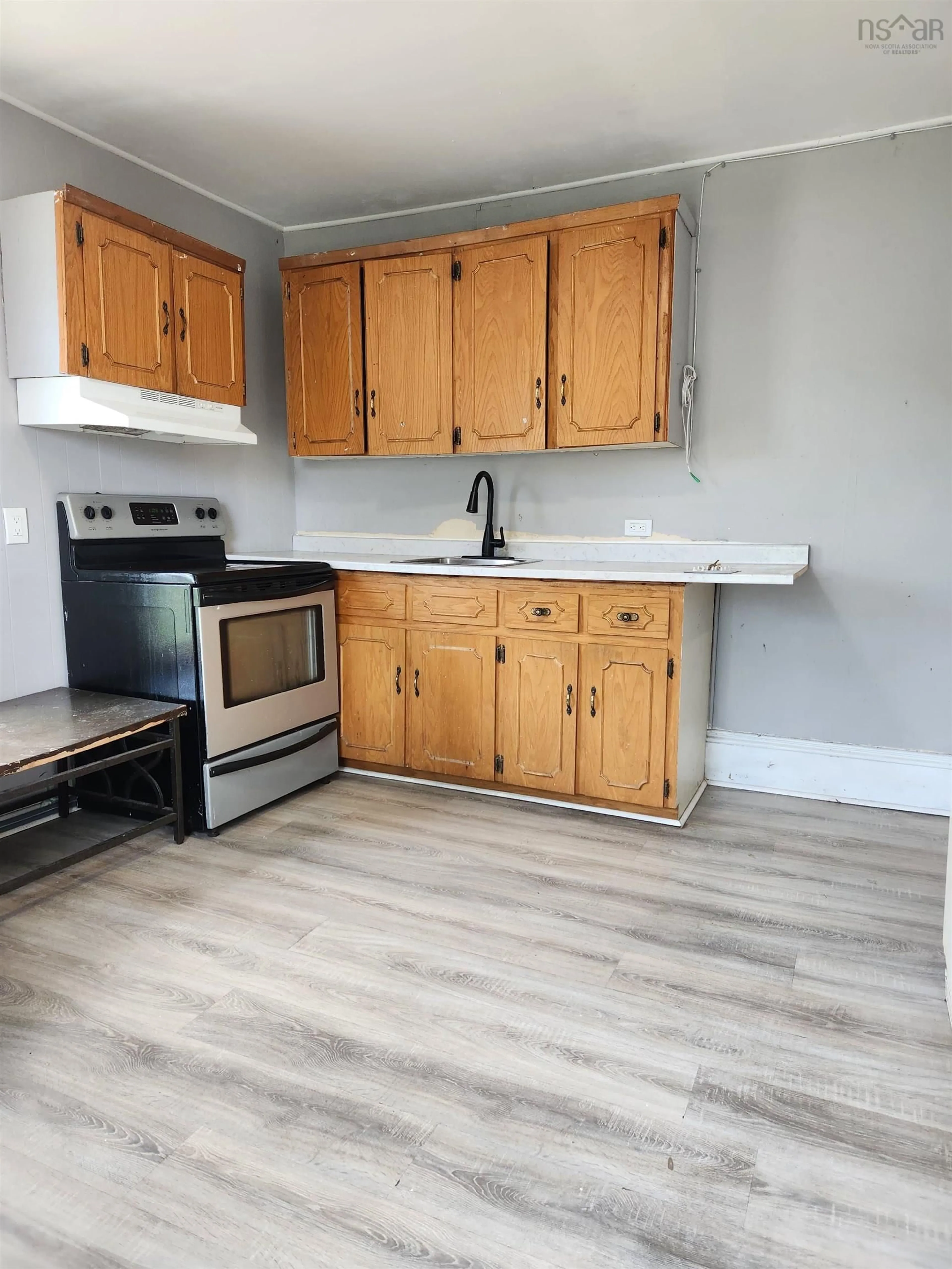Standard kitchen, wood/laminate floor for 17 Ferry St, Cape Breton Island Nova Scotia B1P 5Z9