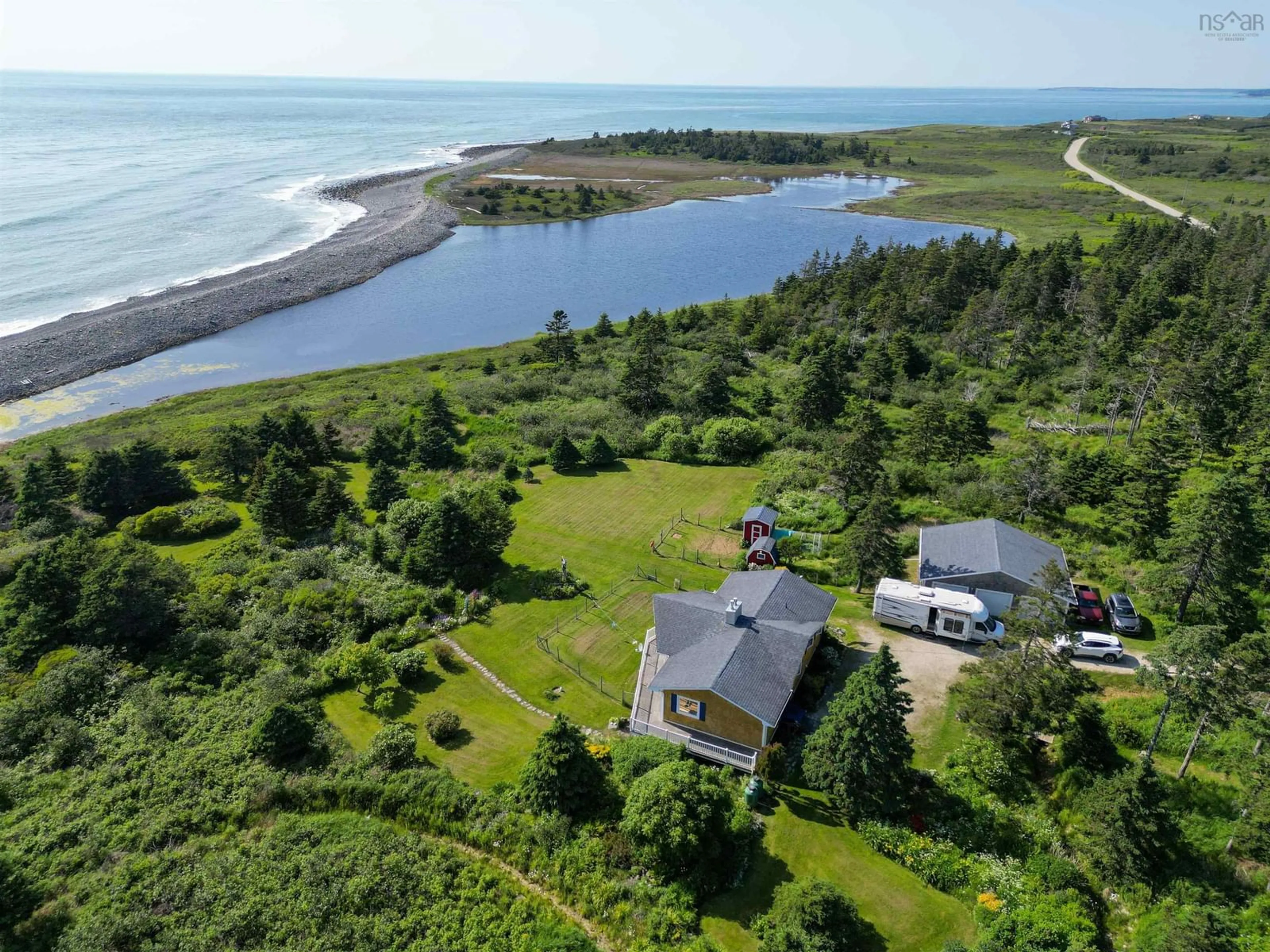 A pic from outside/outdoor area/front of a property/back of a property/a pic from drone, water/lake/river/ocean view for 2815 Main Shore Rd, Port Maitland Nova Scotia B5A 5C4