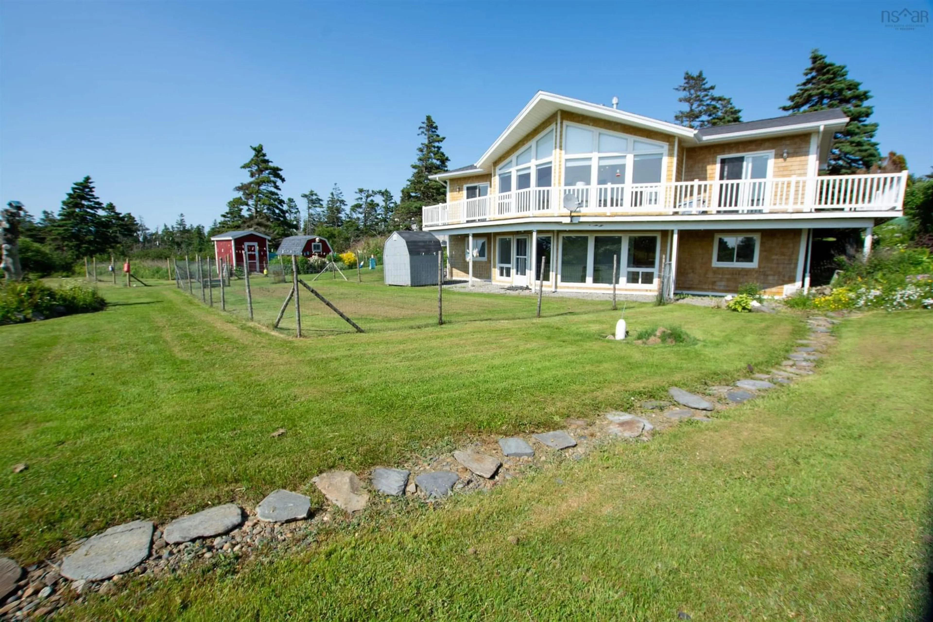 A pic from outside/outdoor area/front of a property/back of a property/a pic from drone, water/lake/river/ocean view for 2815 Main Shore Rd, Port Maitland Nova Scotia B5A 5C4