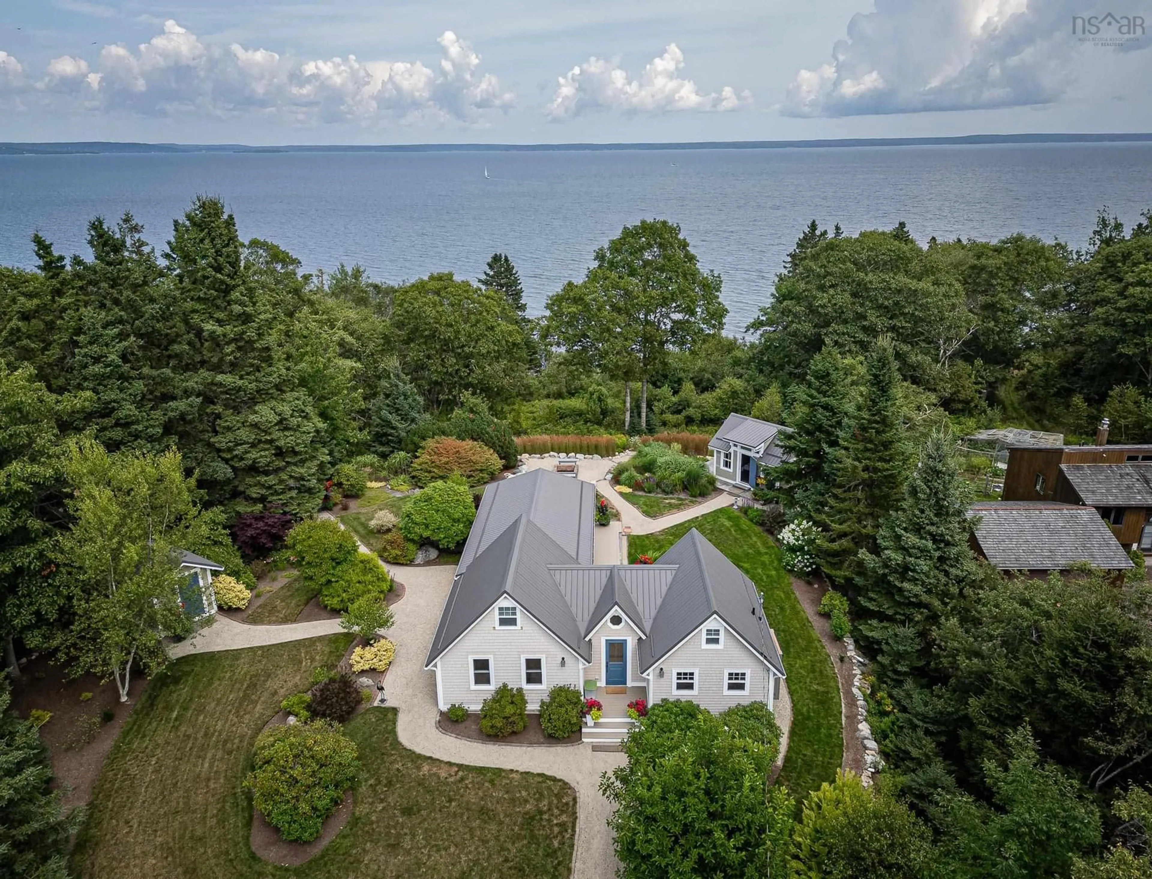 A pic from outside/outdoor area/front of a property/back of a property/a pic from drone, water/lake/river/ocean view for 17 Mill Cove Shore Rd, Mill Cove Nova Scotia B0J 1T0