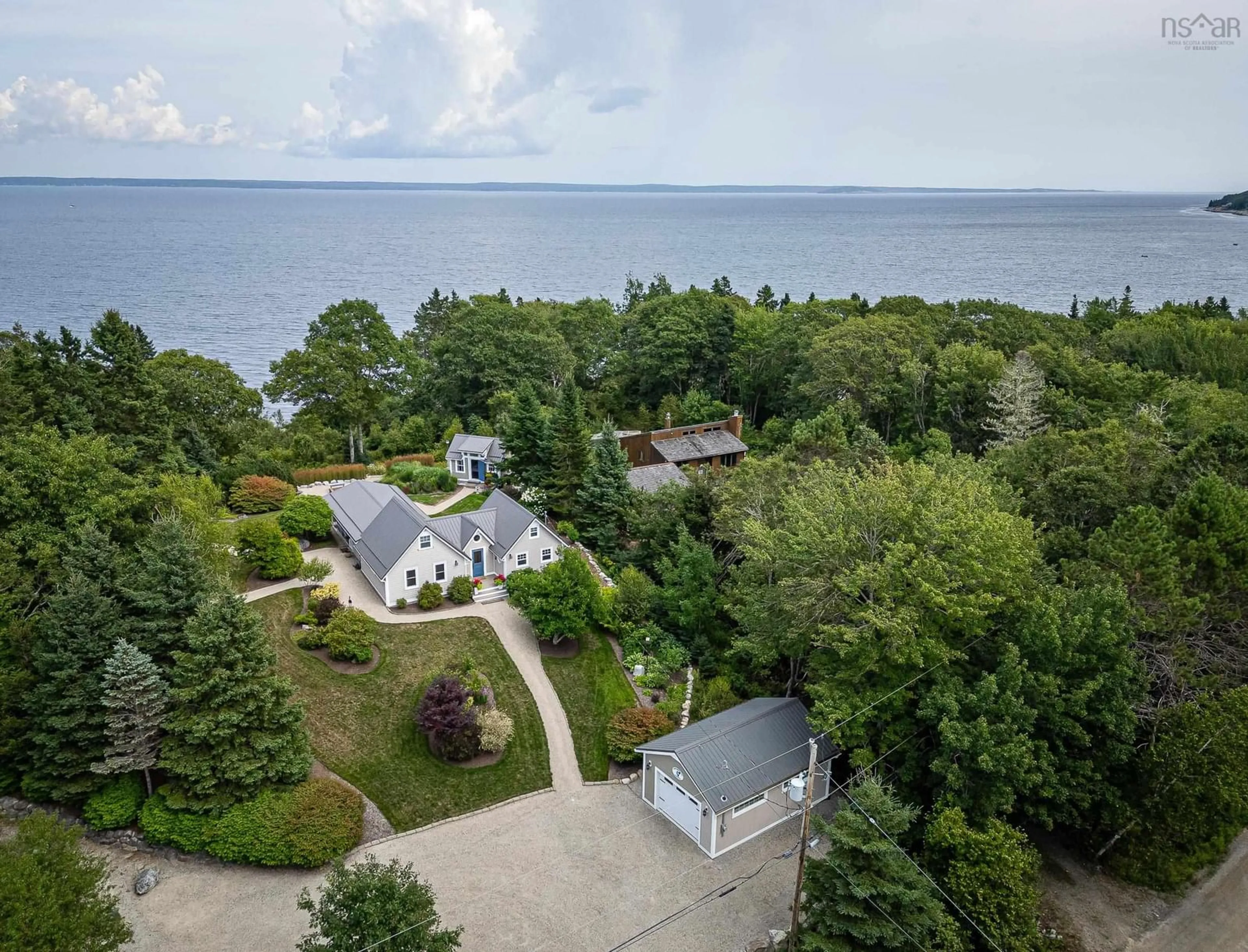 A pic from outside/outdoor area/front of a property/back of a property/a pic from drone, water/lake/river/ocean view for 17 Mill Cove Shore Rd, Mill Cove Nova Scotia B0J 1T0