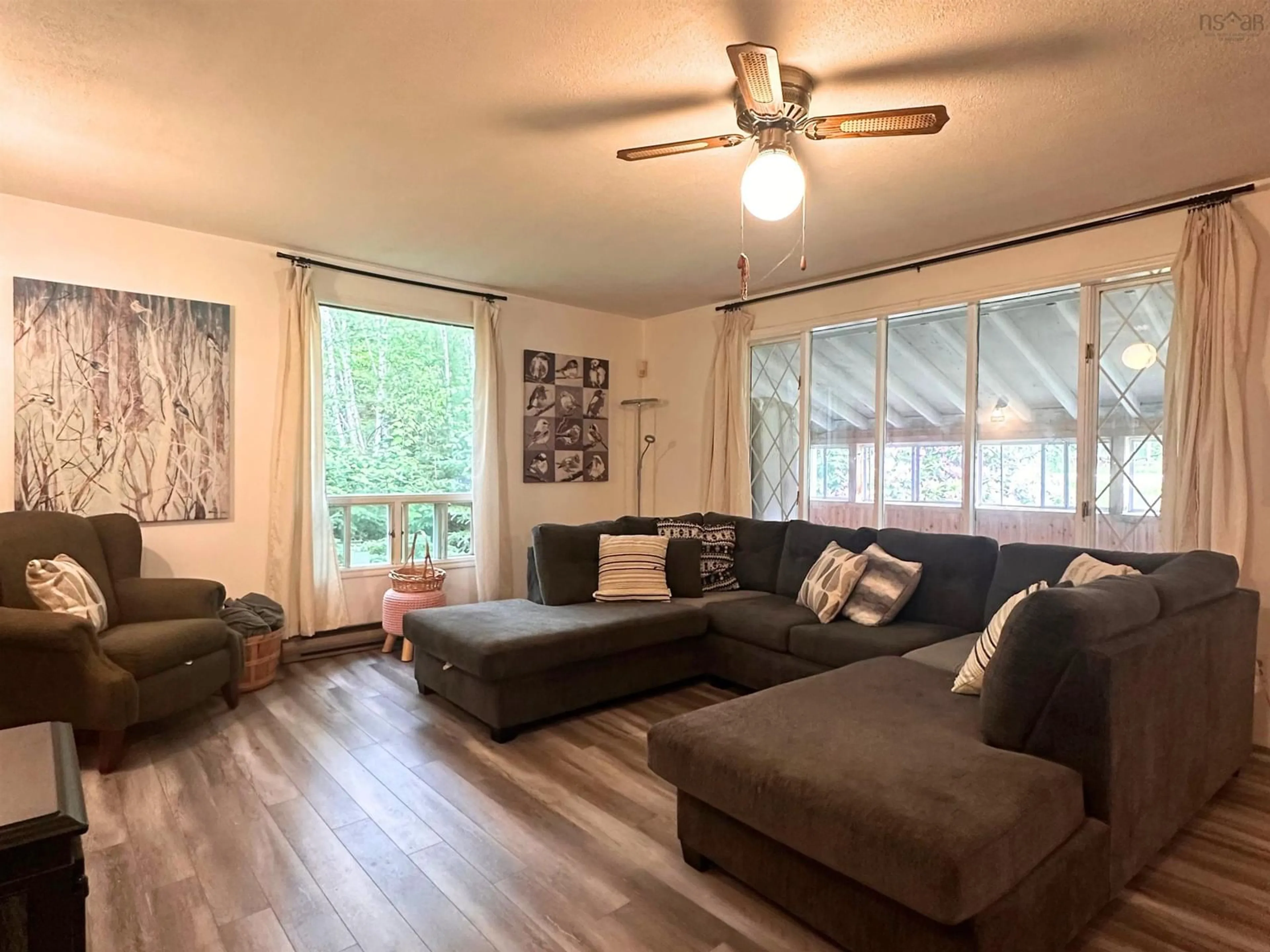 Living room with furniture, wood/laminate floor for 5662 Highway 325, West Clifford Nova Scotia B4V 8G8