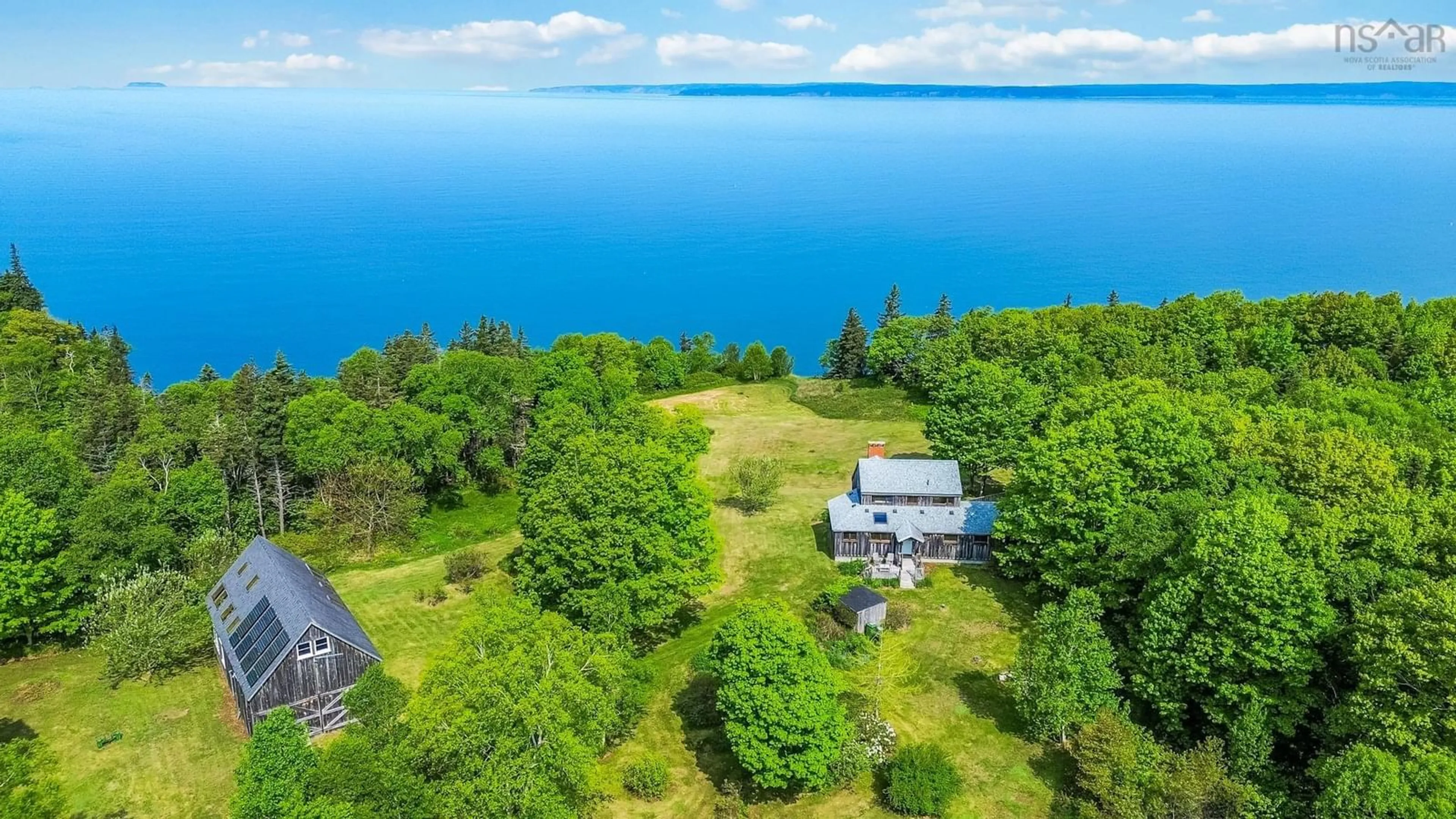 A pic from outside/outdoor area/front of a property/back of a property/a pic from drone, water/lake/river/ocean view for 203 Al Bennett Rd, Halls Harbour Nova Scotia B0P 1J0