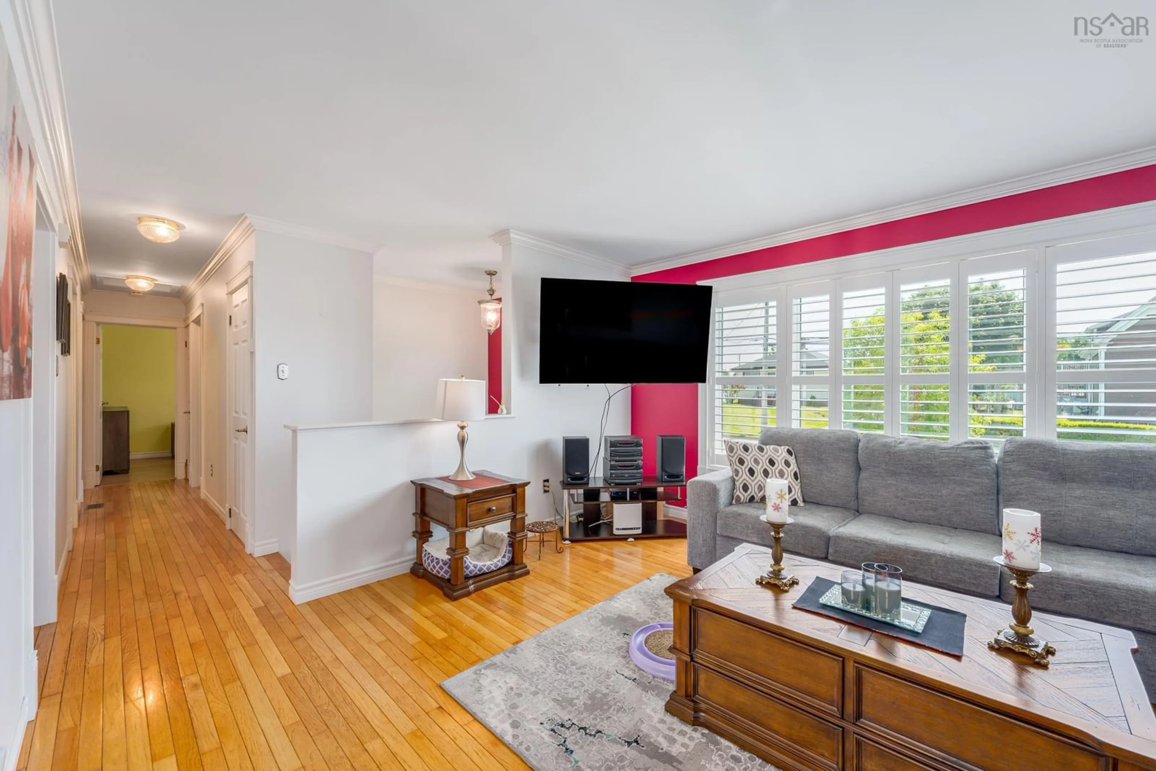Living room with furniture, wood/laminate floor for 304 Pleasant St, Yarmouth Nova Scotia B5A 4L6