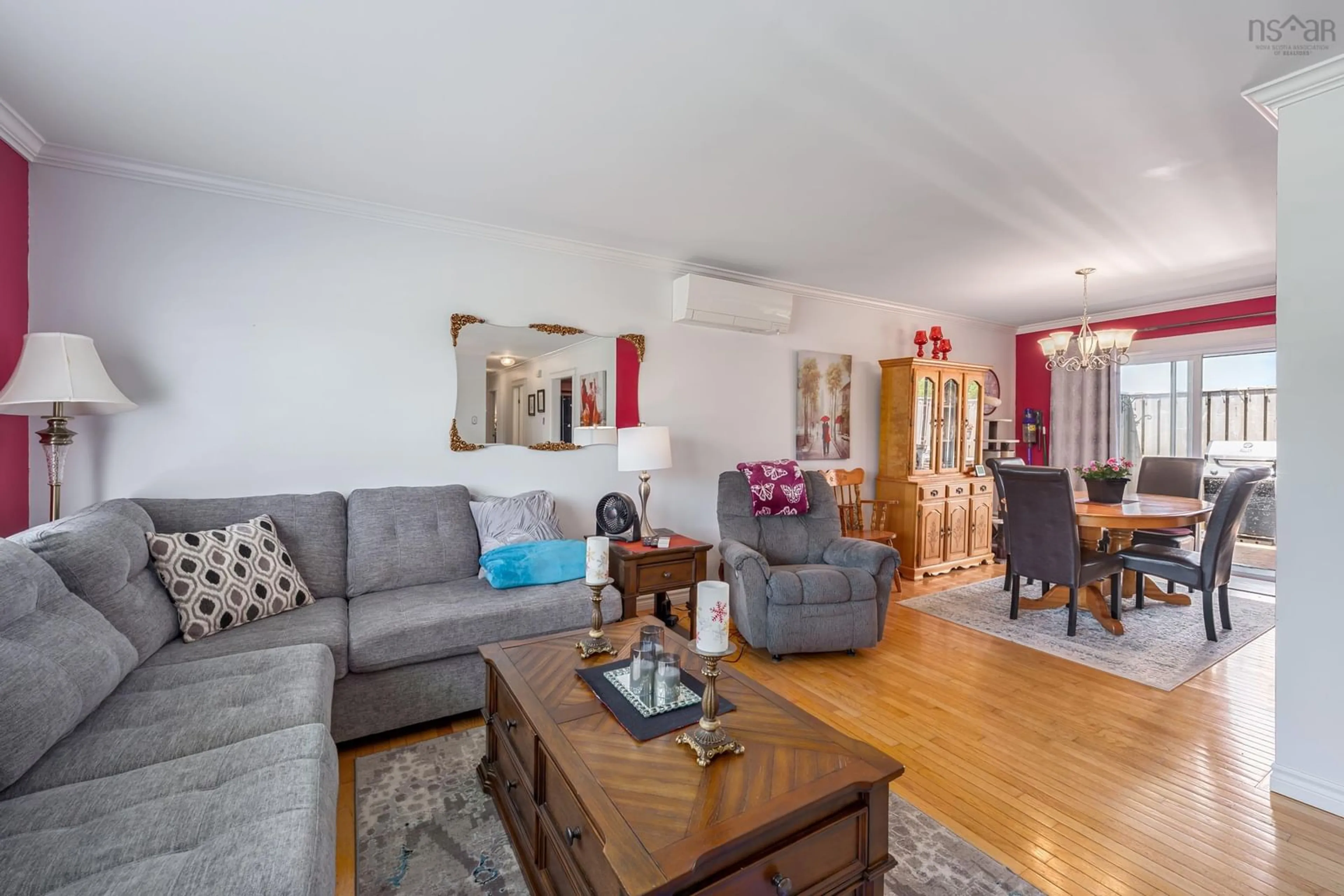 Living room with furniture, wood/laminate floor for 304 Pleasant St, Yarmouth Nova Scotia B5A 4L6
