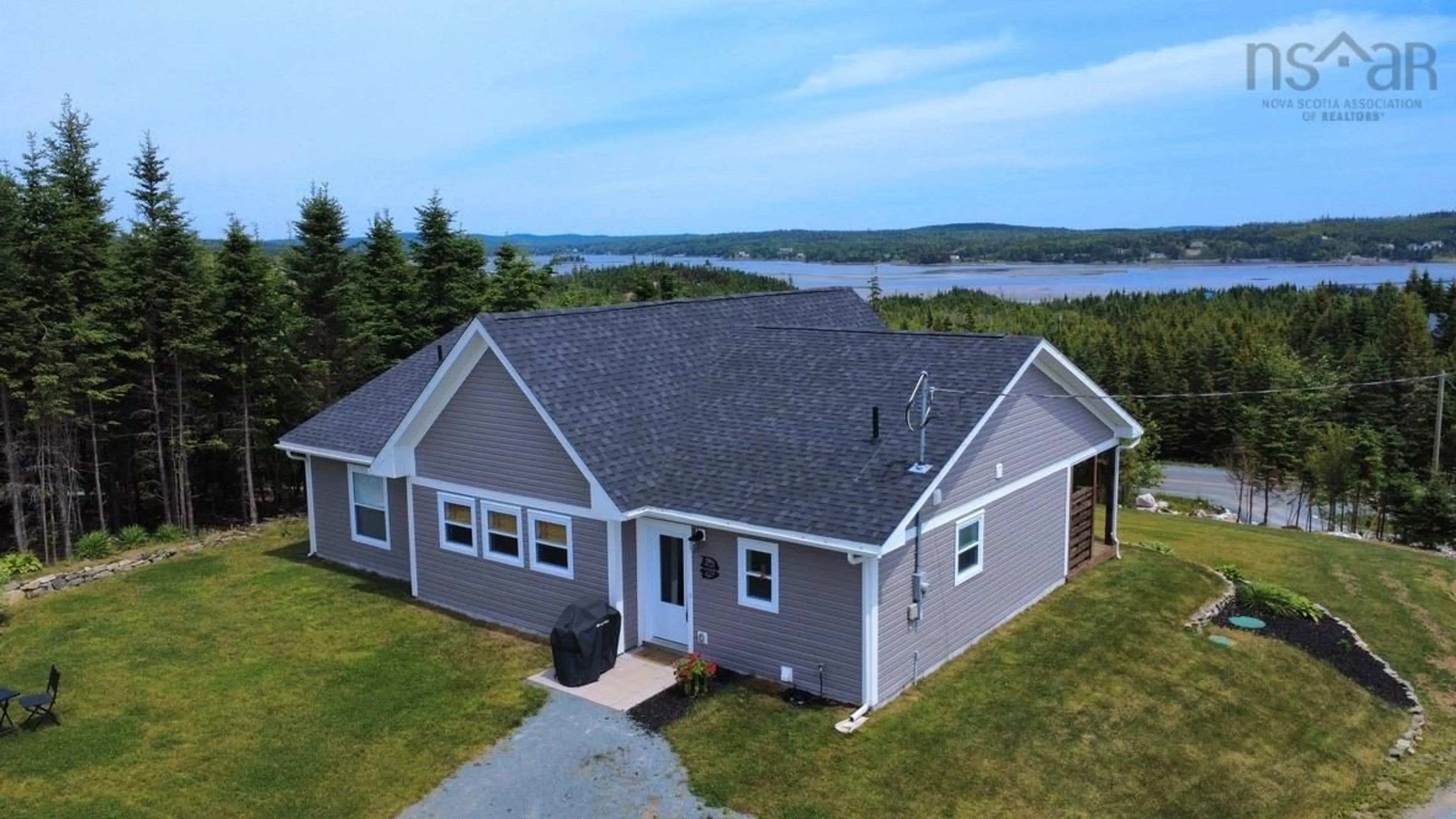 A pic from outside/outdoor area/front of a property/back of a property/a pic from drone, water/lake/river/ocean view for 910 West Petpeswick Rd, West Petpeswick Nova Scotia B0J 2L0