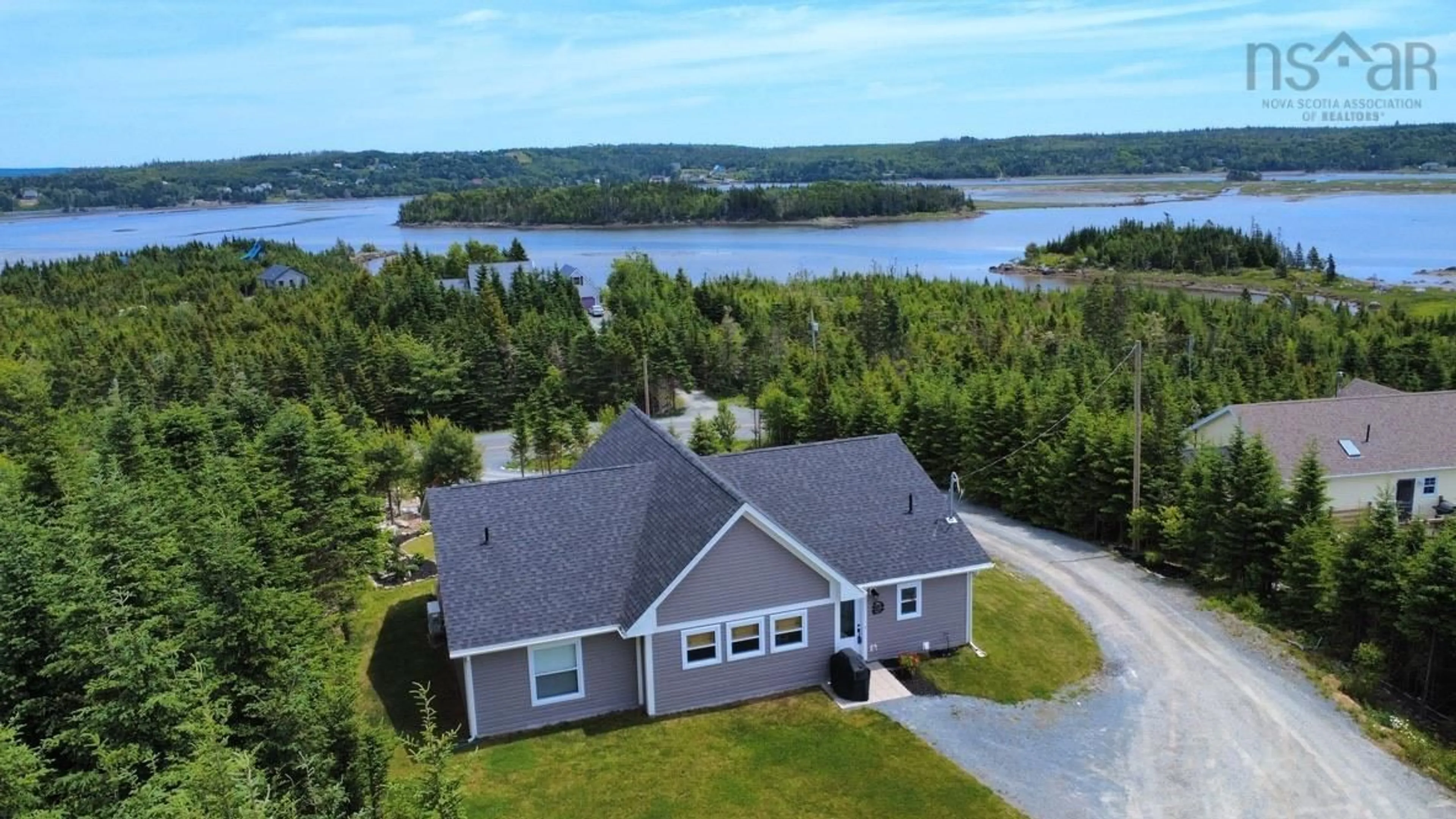 A pic from outside/outdoor area/front of a property/back of a property/a pic from drone, water/lake/river/ocean view for 910 West Petpeswick Rd, West Petpeswick Nova Scotia B0J 2L0