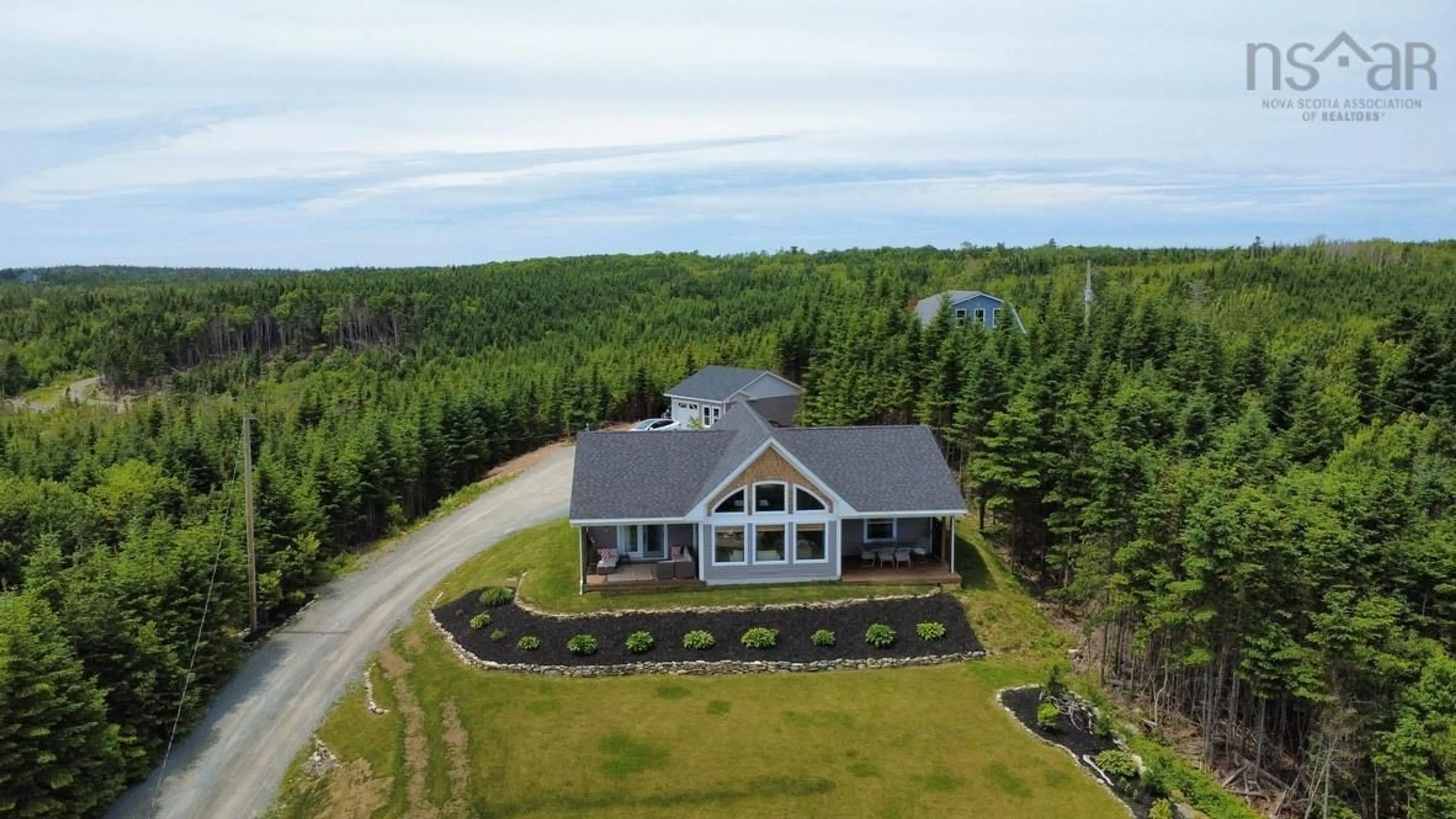 A pic from outside/outdoor area/front of a property/back of a property/a pic from drone, water/lake/river/ocean view for 910 West Petpeswick Rd, West Petpeswick Nova Scotia B0J 2L0
