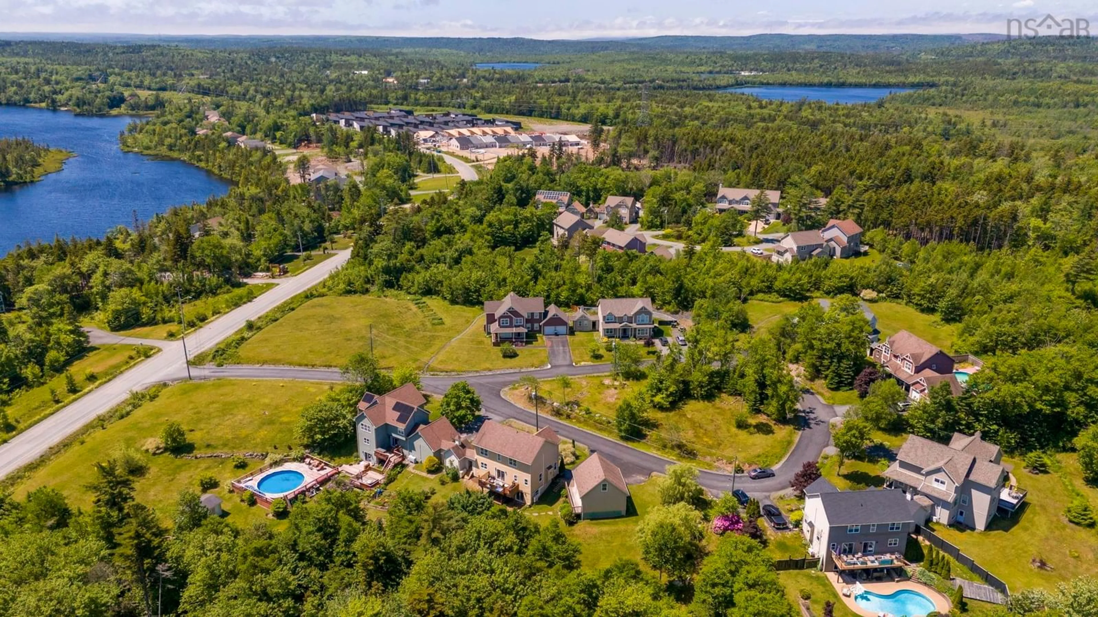 A pic from outside/outdoor area/front of a property/back of a property/a pic from drone, water/lake/river/ocean view for 37 Equine Crt, Hammonds Plains Nova Scotia B4B 2B1