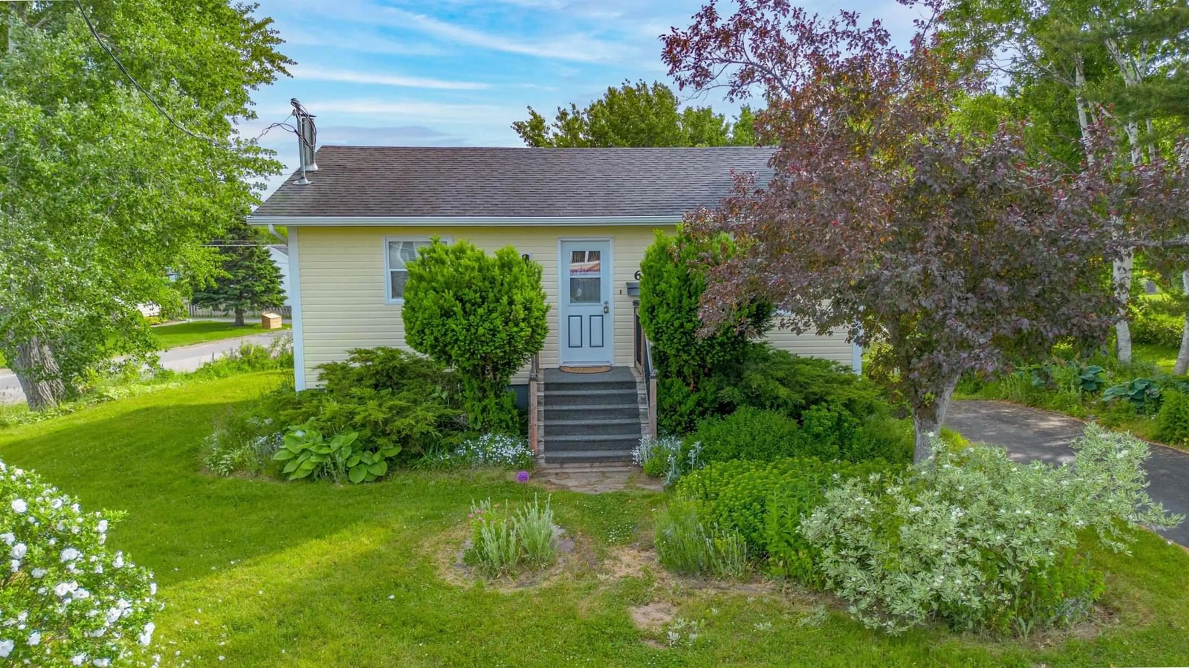 A pic from outside/outdoor area/front of a property/back of a property/a pic from drone, street for 6 Macinnis Dr, North Sydney Nova Scotia B2A 3H9