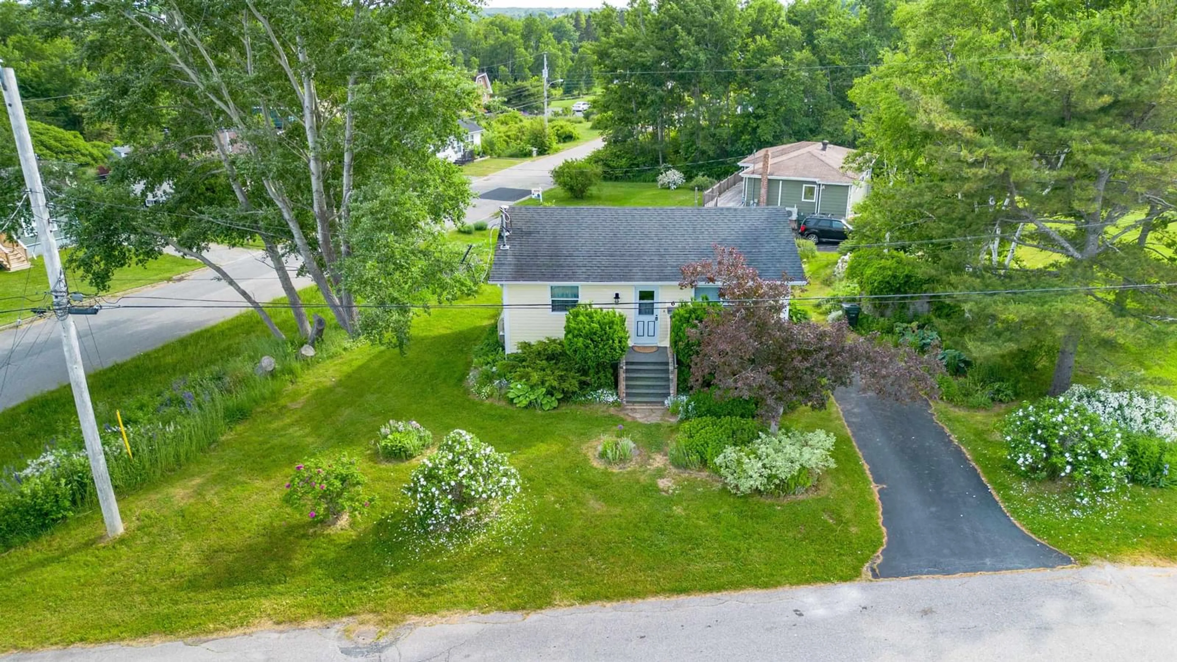 A pic from outside/outdoor area/front of a property/back of a property/a pic from drone, unknown for 6 Macinnis Dr, North Sydney Nova Scotia B2A 3H9