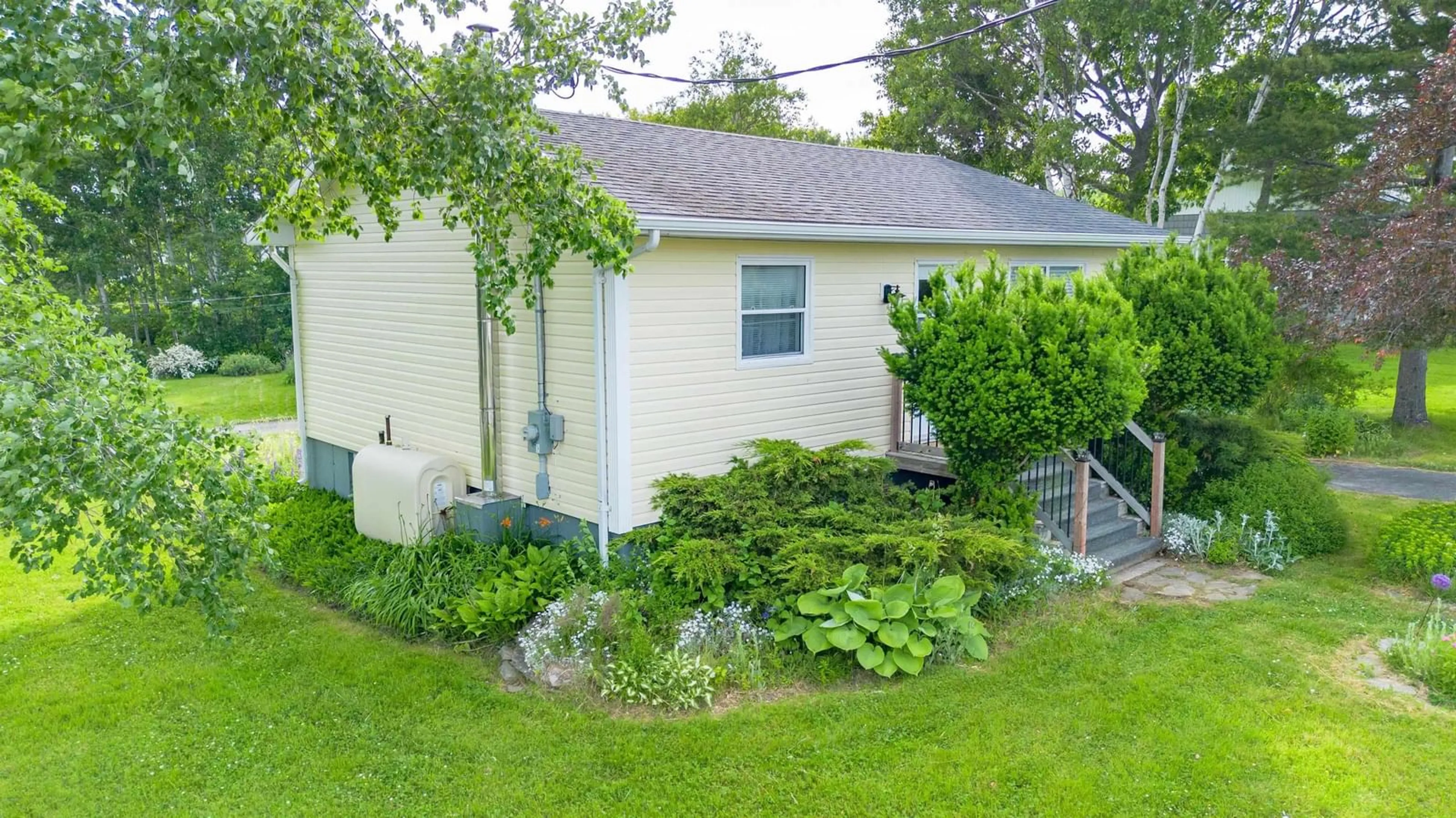 A pic from outside/outdoor area/front of a property/back of a property/a pic from drone, street for 6 Macinnis Dr, North Sydney Nova Scotia B2A 3H9