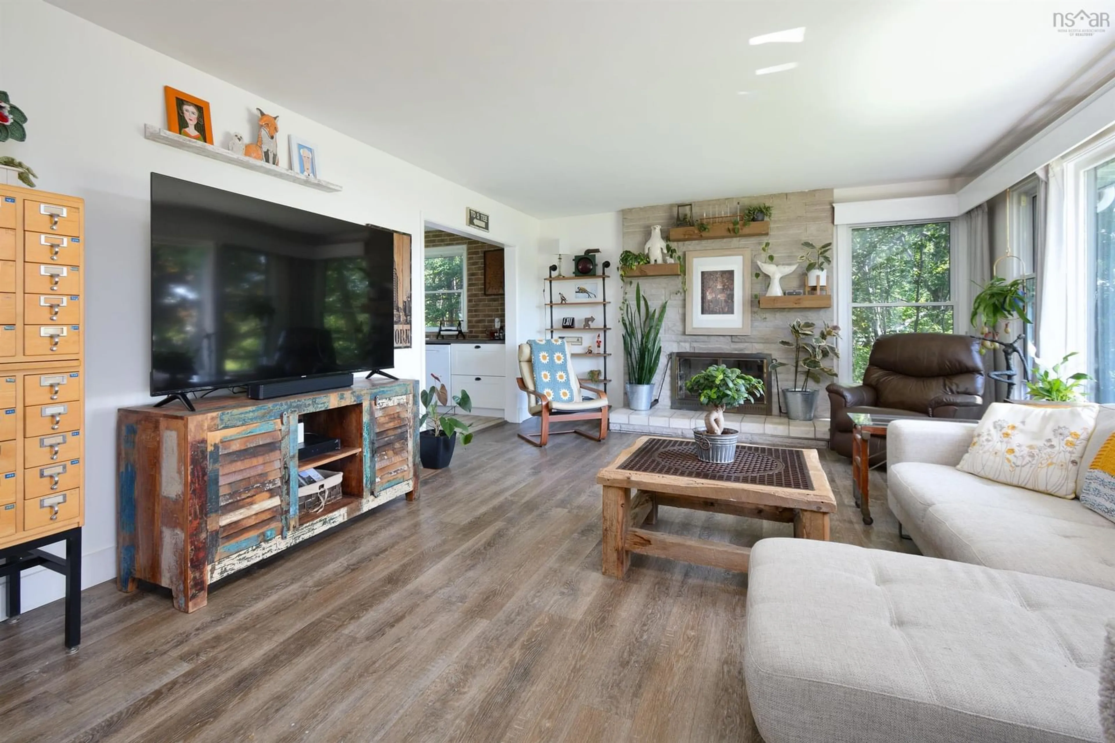 Living room with furniture, wood/laminate floor for 55 Riverdale Dr, Sydney River Nova Scotia B1R 1P2